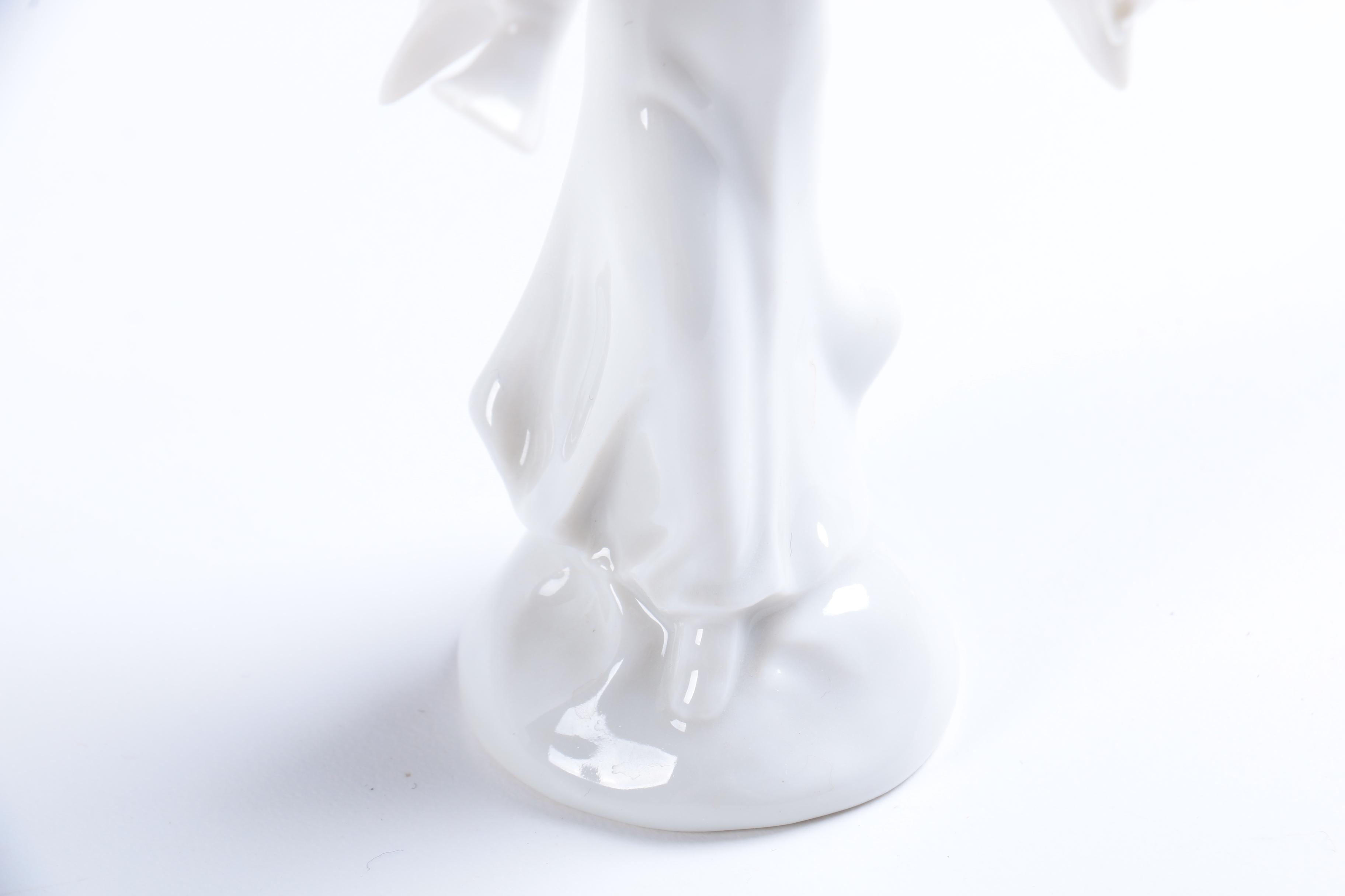 Collection of Eight Dresden Angel Figurines