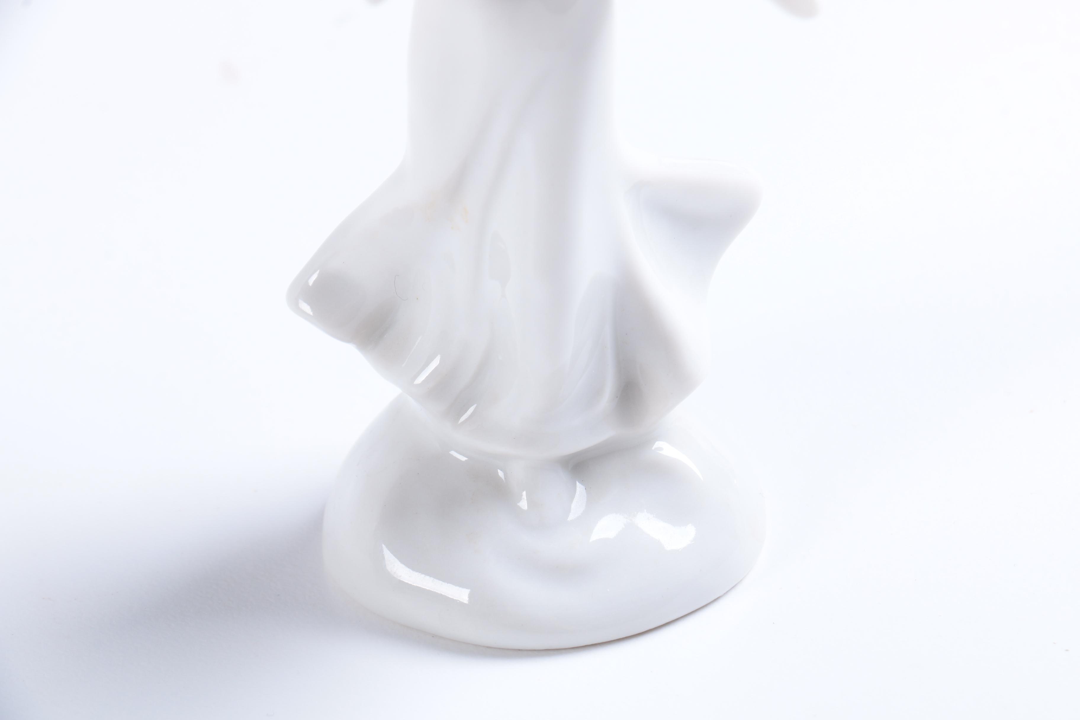 Collection of Eight Dresden Angel Figurines