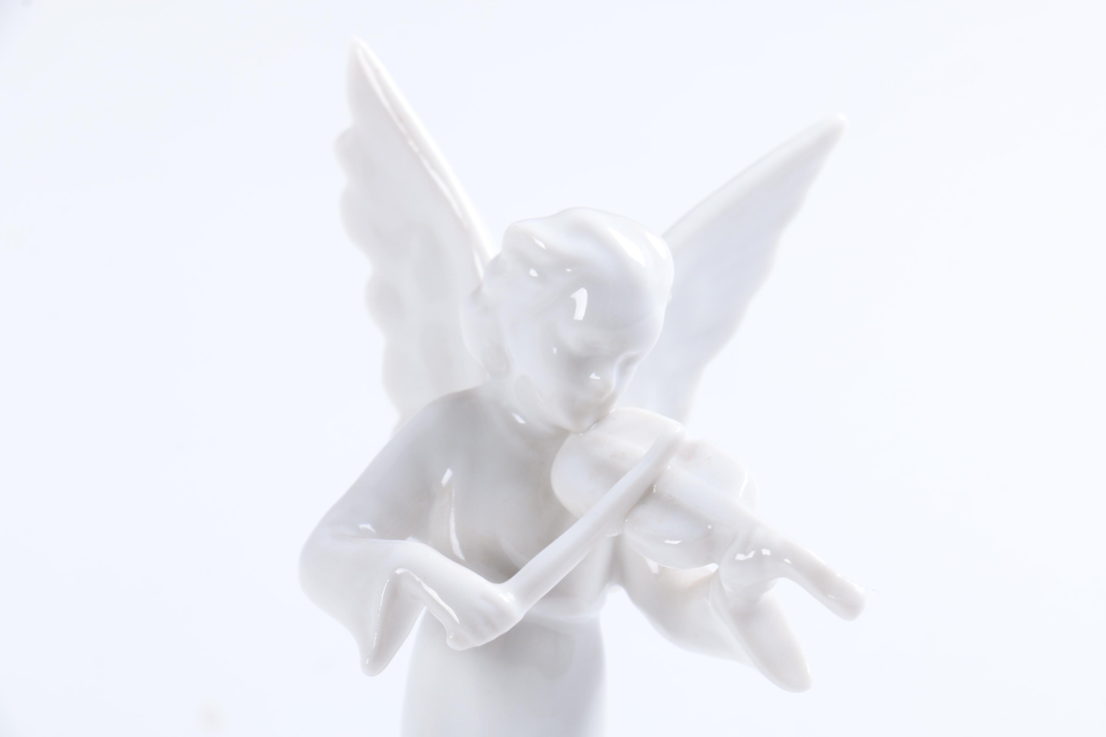 Collection of Eight Dresden Angel Figurines