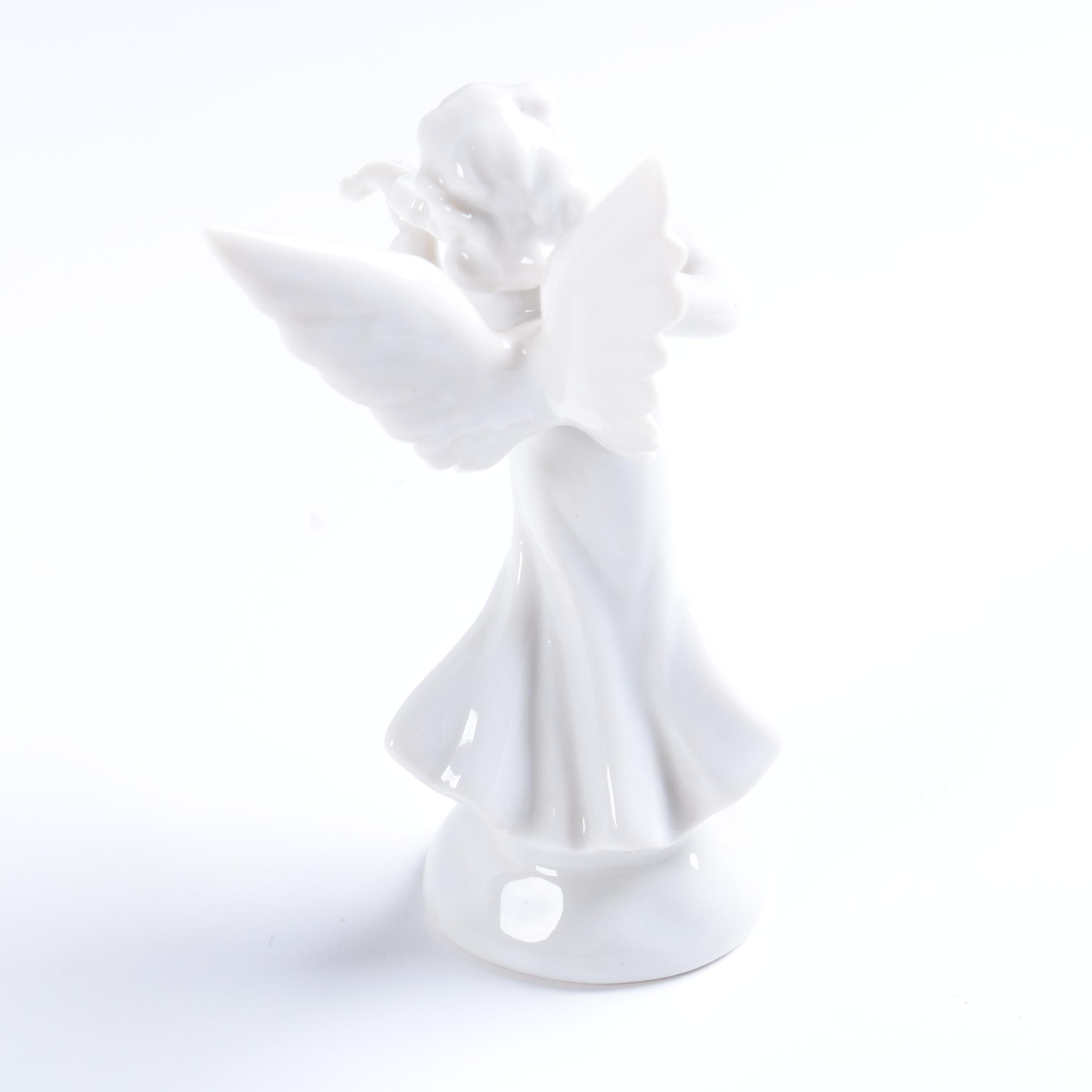 Collection of Eight Dresden Angel Figurines