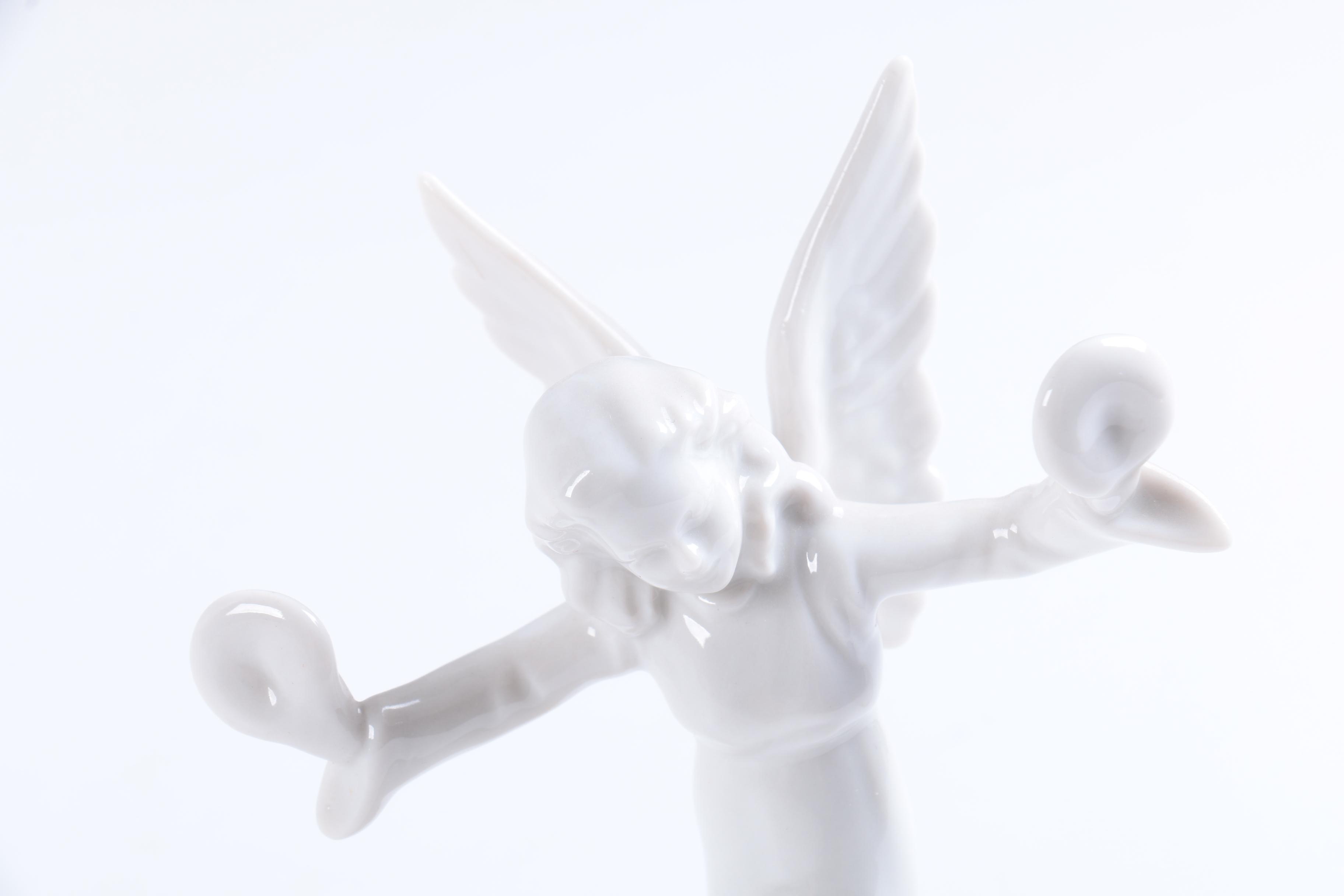 Collection of Eight Dresden Angel Figurines