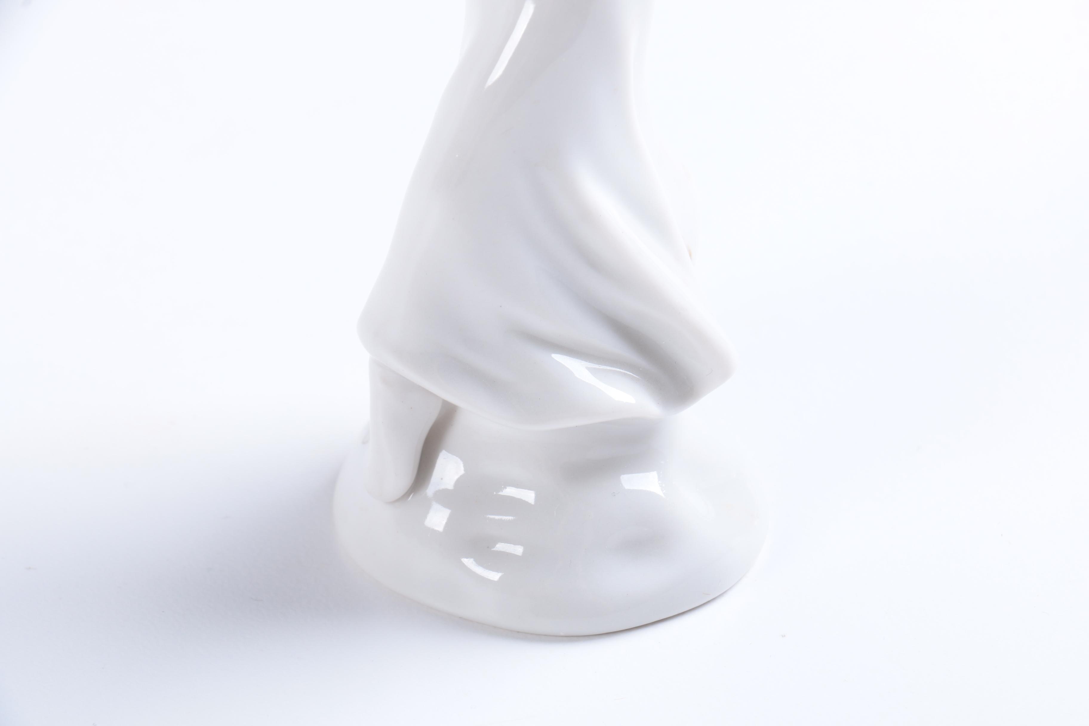 Collection of Eight Dresden Angel Figurines