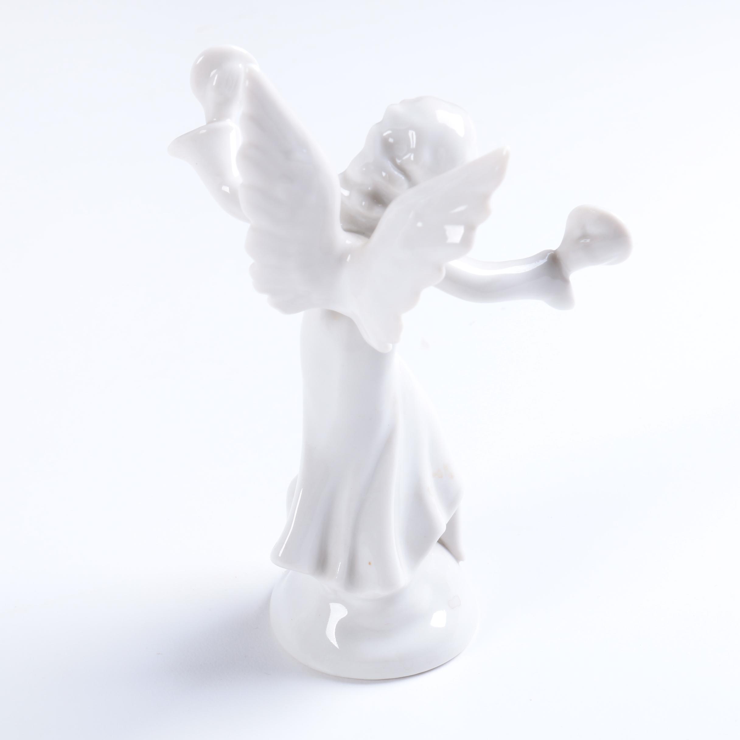Collection of Eight Dresden Angel Figurines