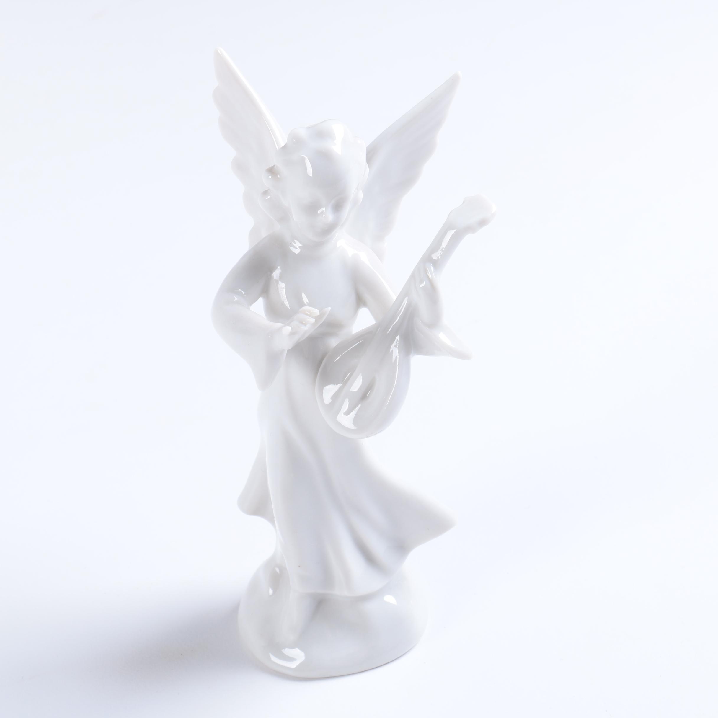 Collection of Eight Dresden Angel Figurines