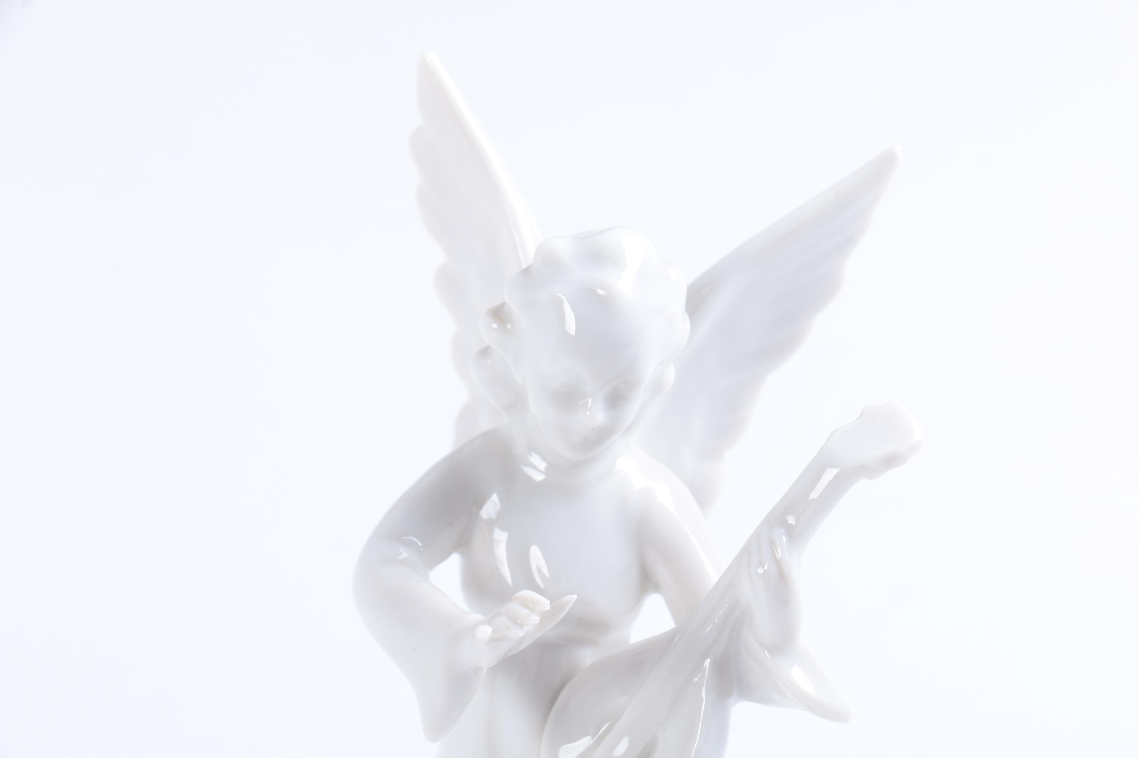 Collection of Eight Dresden Angel Figurines