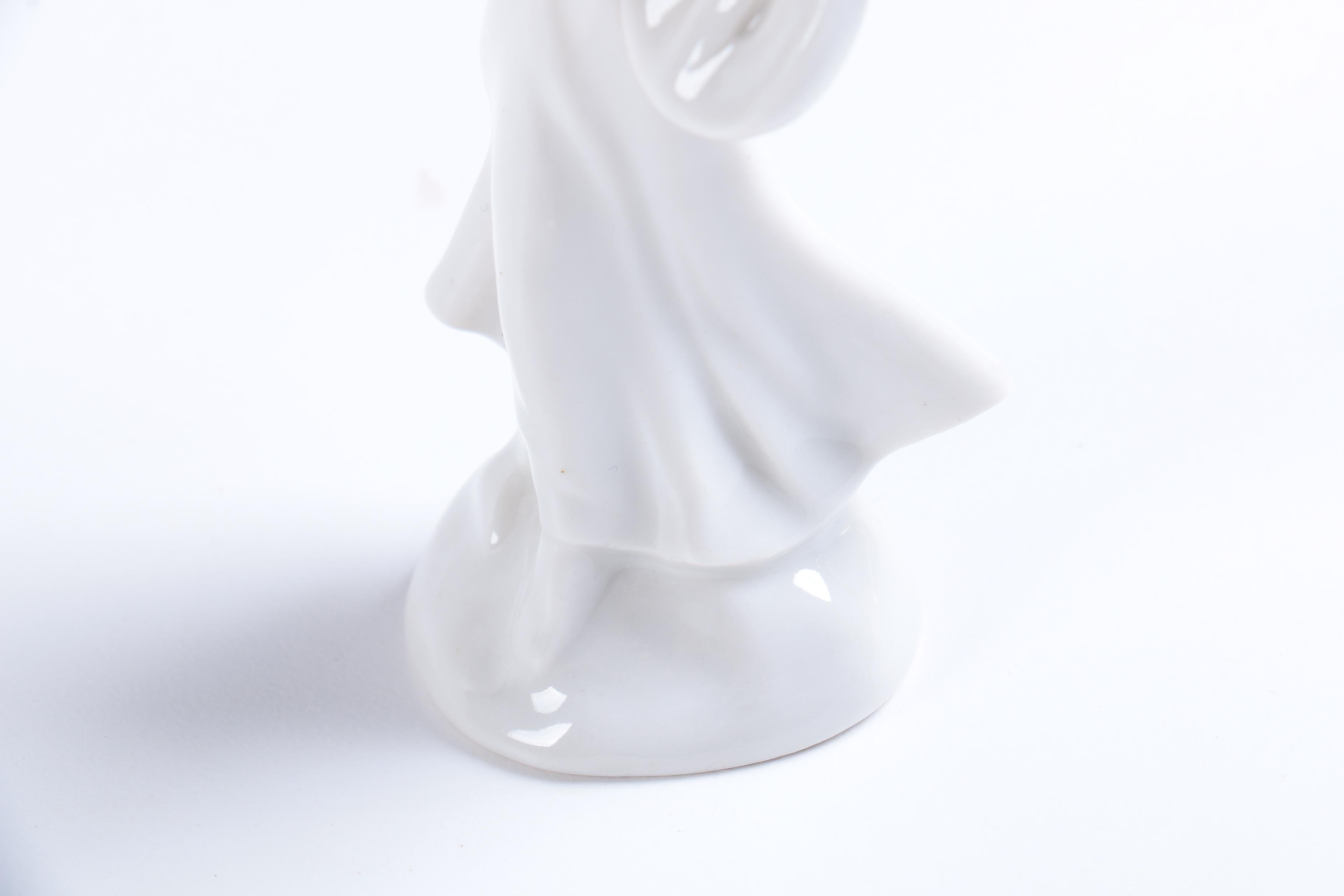 Collection of Eight Dresden Angel Figurines