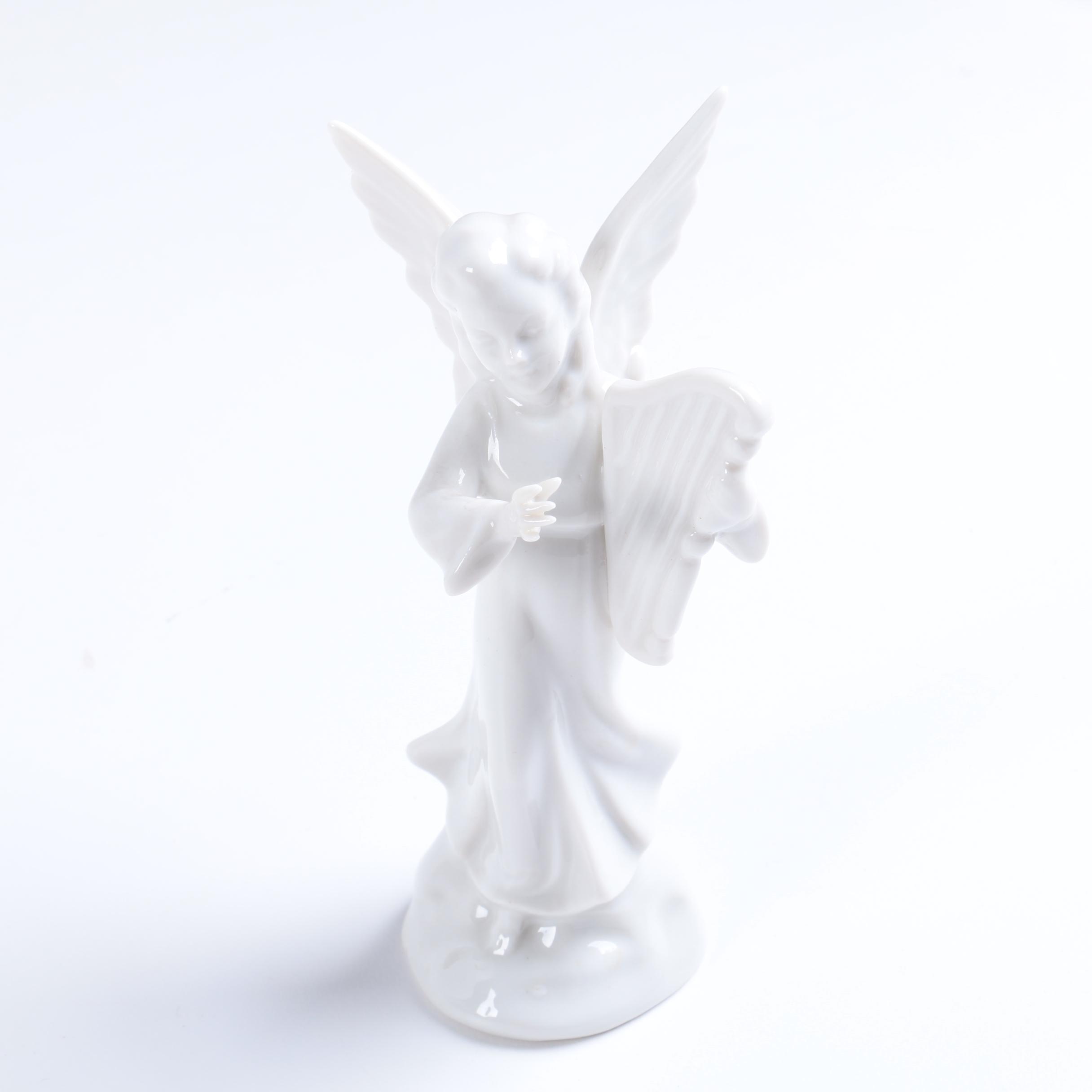 Collection of Eight Dresden Angel Figurines