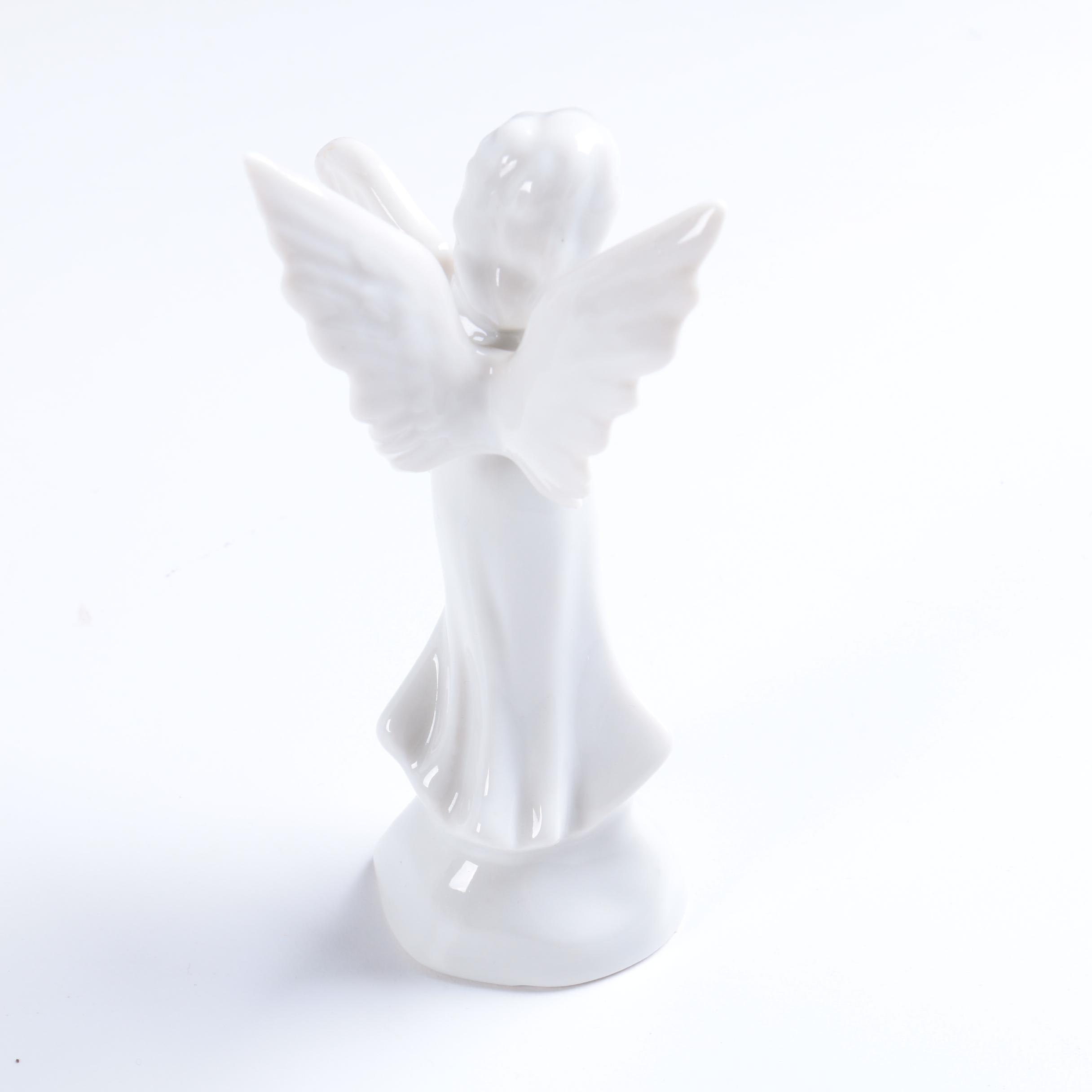 Collection of Eight Dresden Angel Figurines