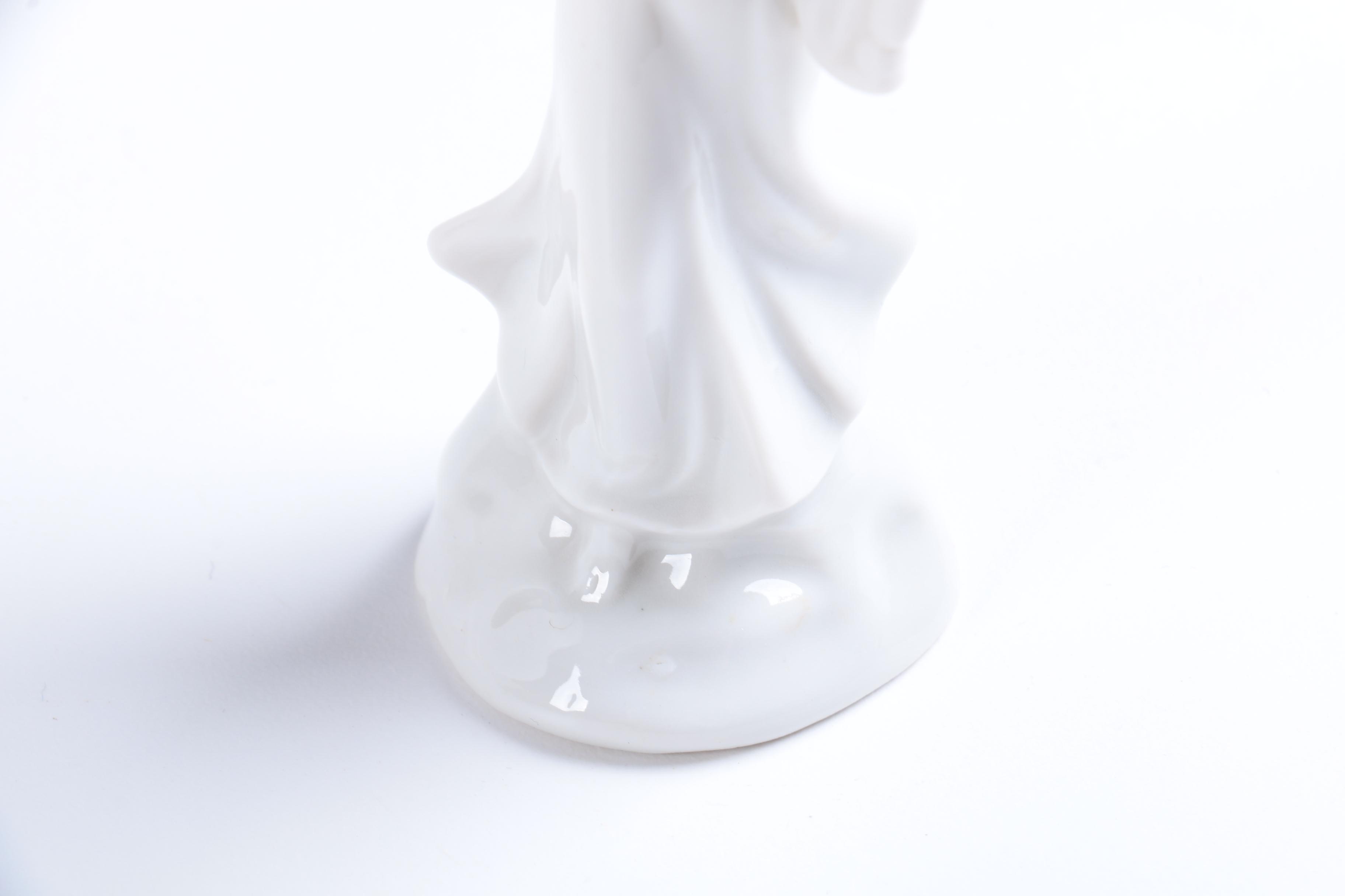 Collection of Eight Dresden Angel Figurines