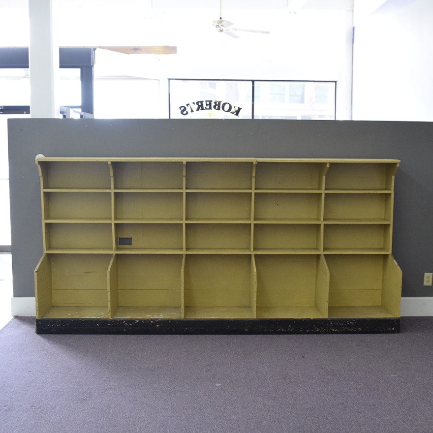 Yellow-Painted Wood Shelving with Cubby Compartments