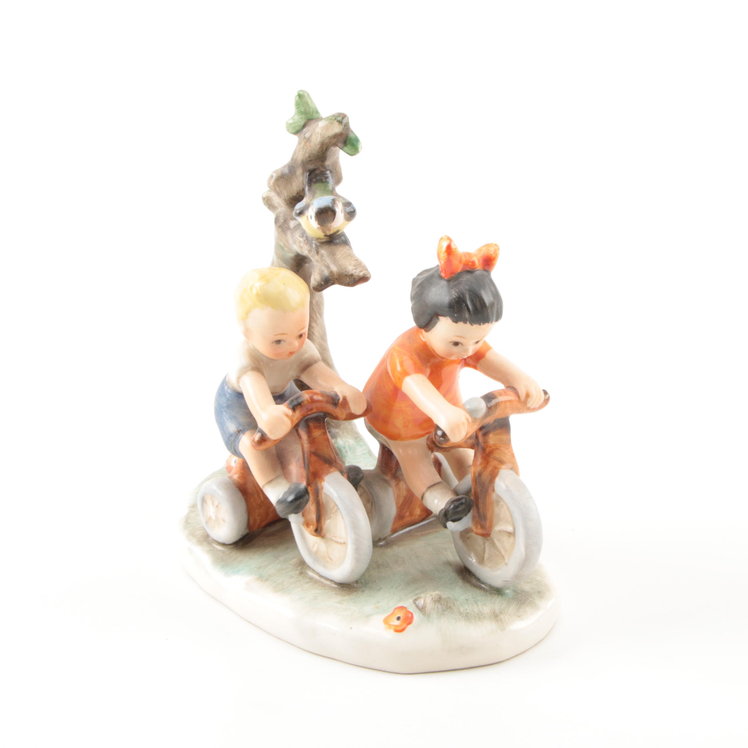 Hand-Painted Goebel Figurine of Children on Bikes