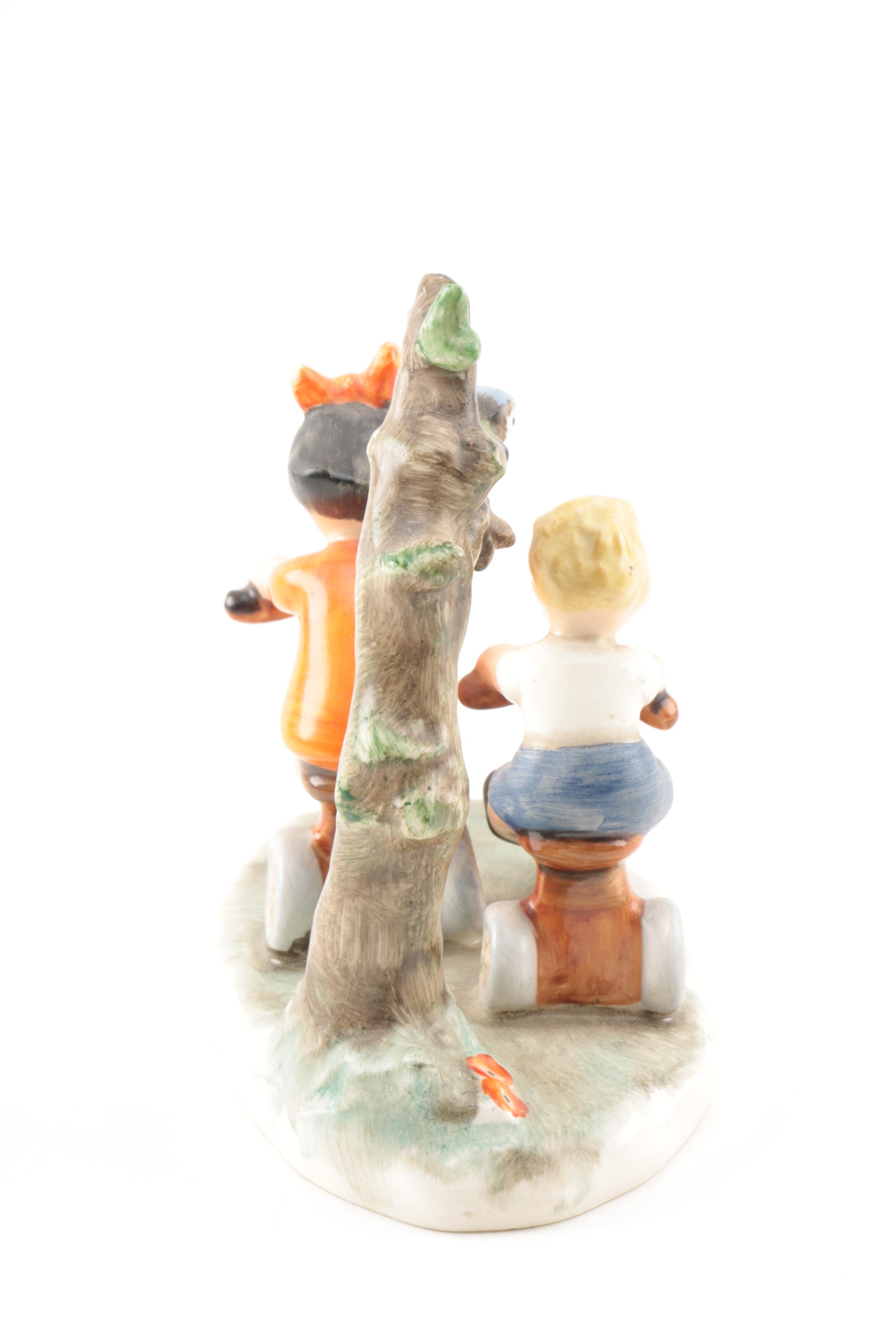 Hand-Painted Goebel Figurine of Children on Bikes
