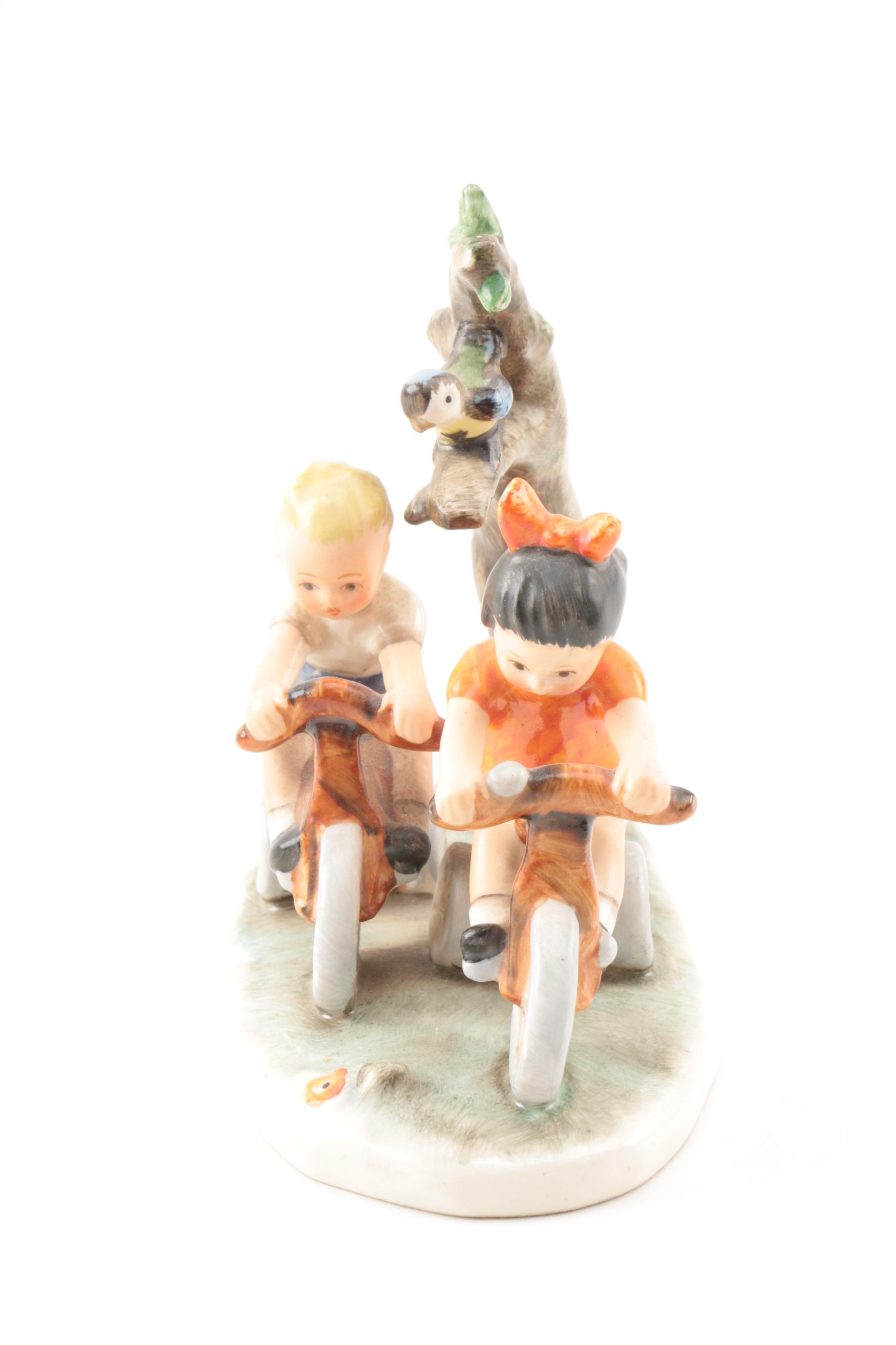Hand-Painted Goebel Figurine of Children on Bikes