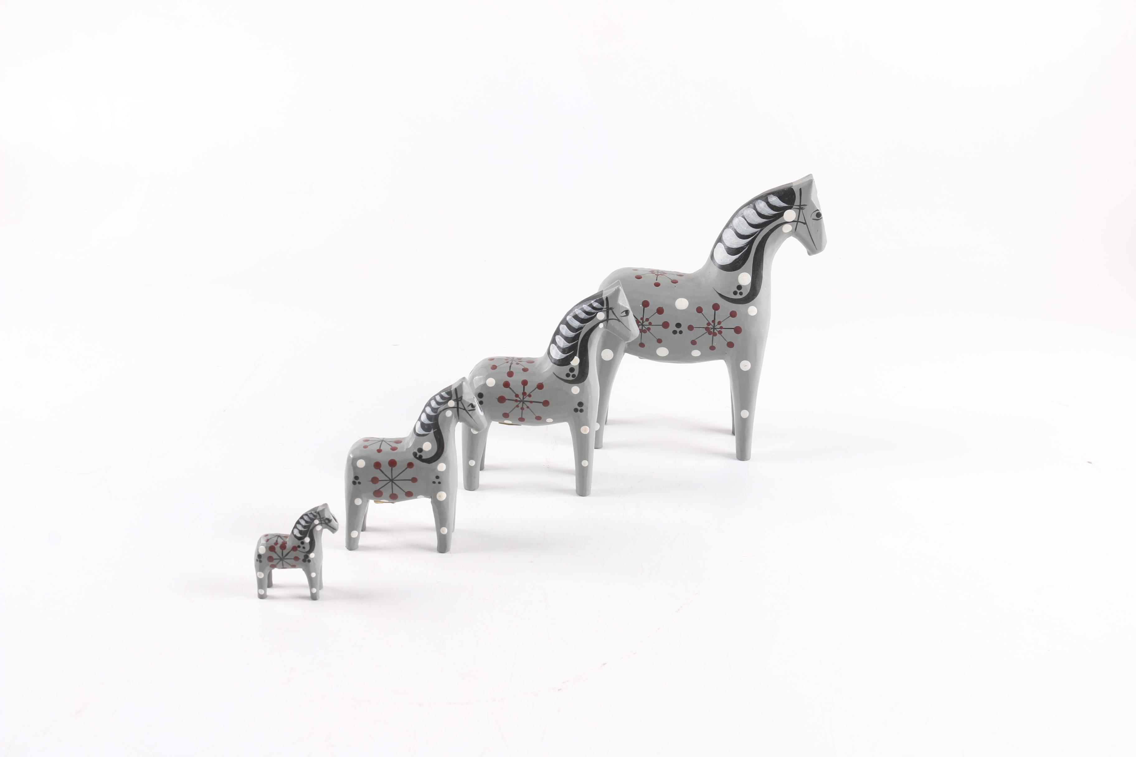 Four and Two Red "John Gudmunds" Dala Horses