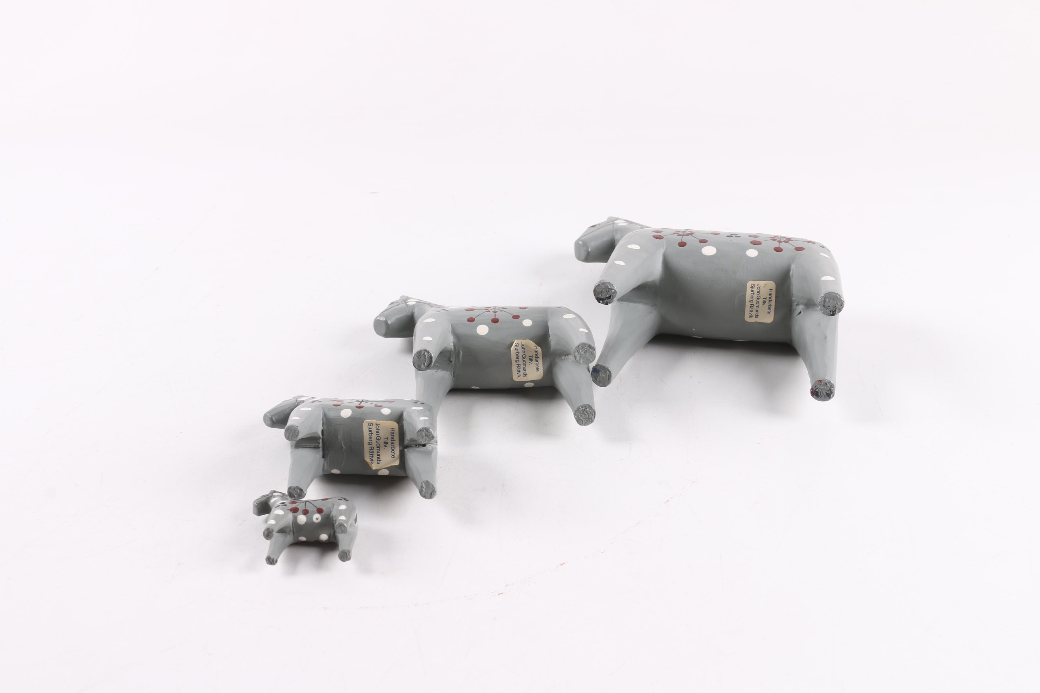 Four and Two Red "John Gudmunds" Dala Horses