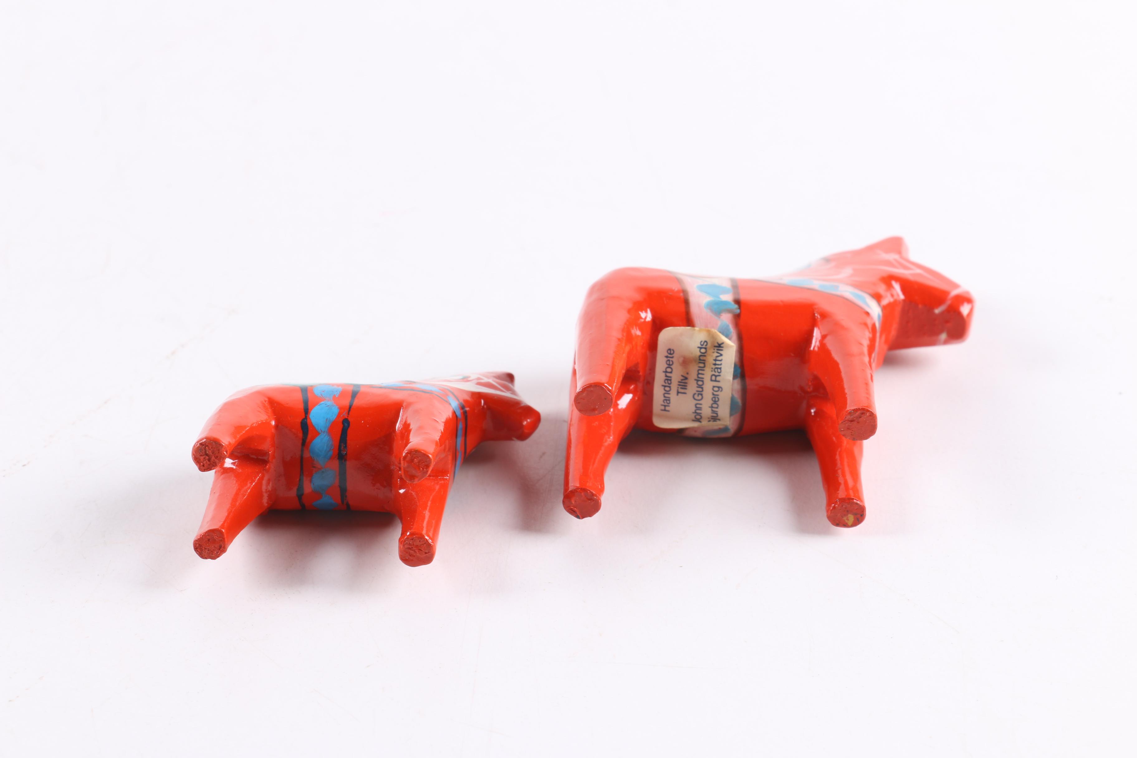 Four and Two Red "John Gudmunds" Dala Horses