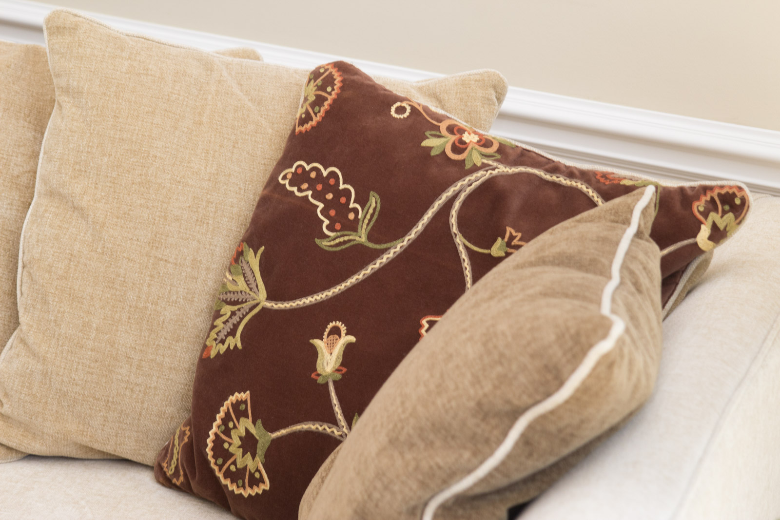 Upholstered Arhaus Sectional Sofa with Decorative Pillows