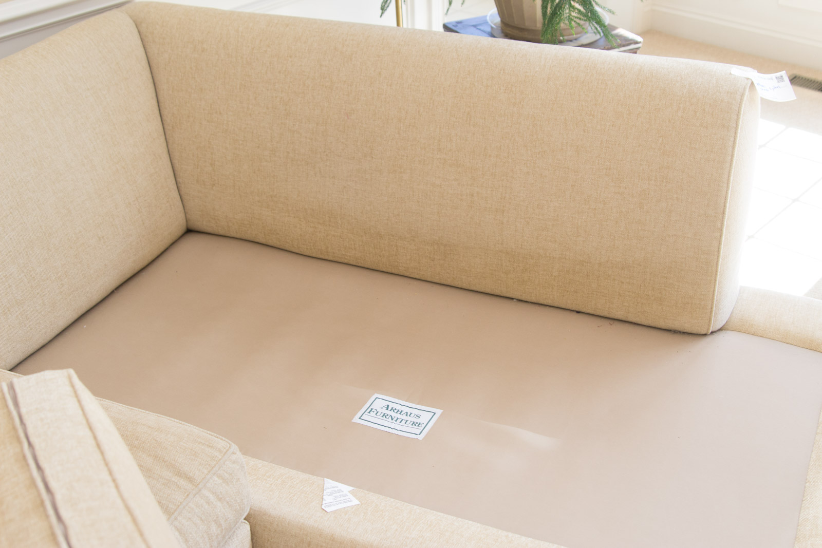 Upholstered Arhaus Sectional Sofa with Decorative Pillows