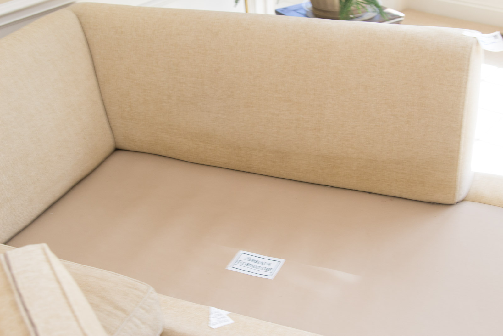 Upholstered Arhaus Sectional Sofa with Decorative Pillows