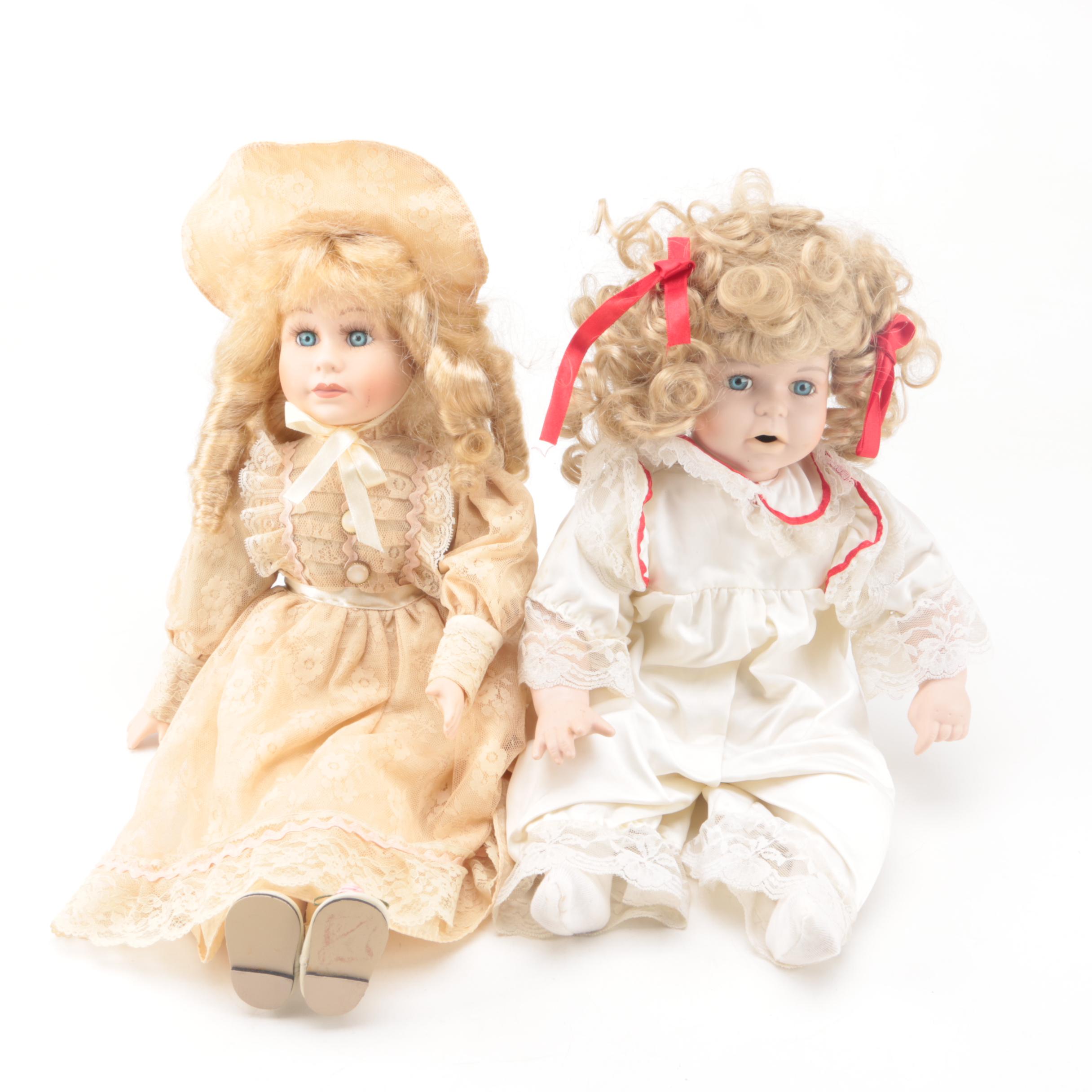 Vintage Porcelain Dolls with Blue Eyes and Blonde Curls