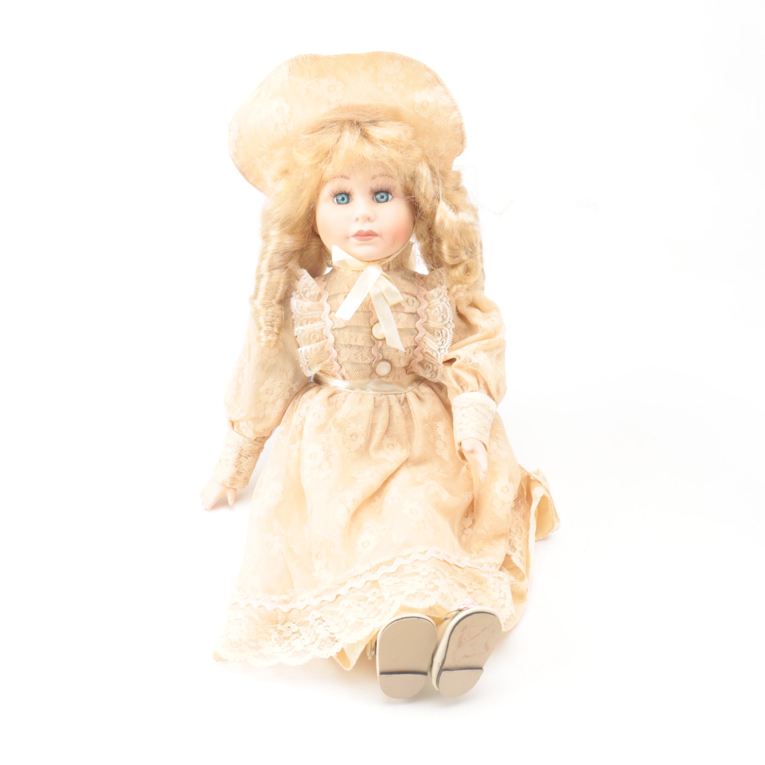Vintage Porcelain Dolls with Blue Eyes and Blonde Curls