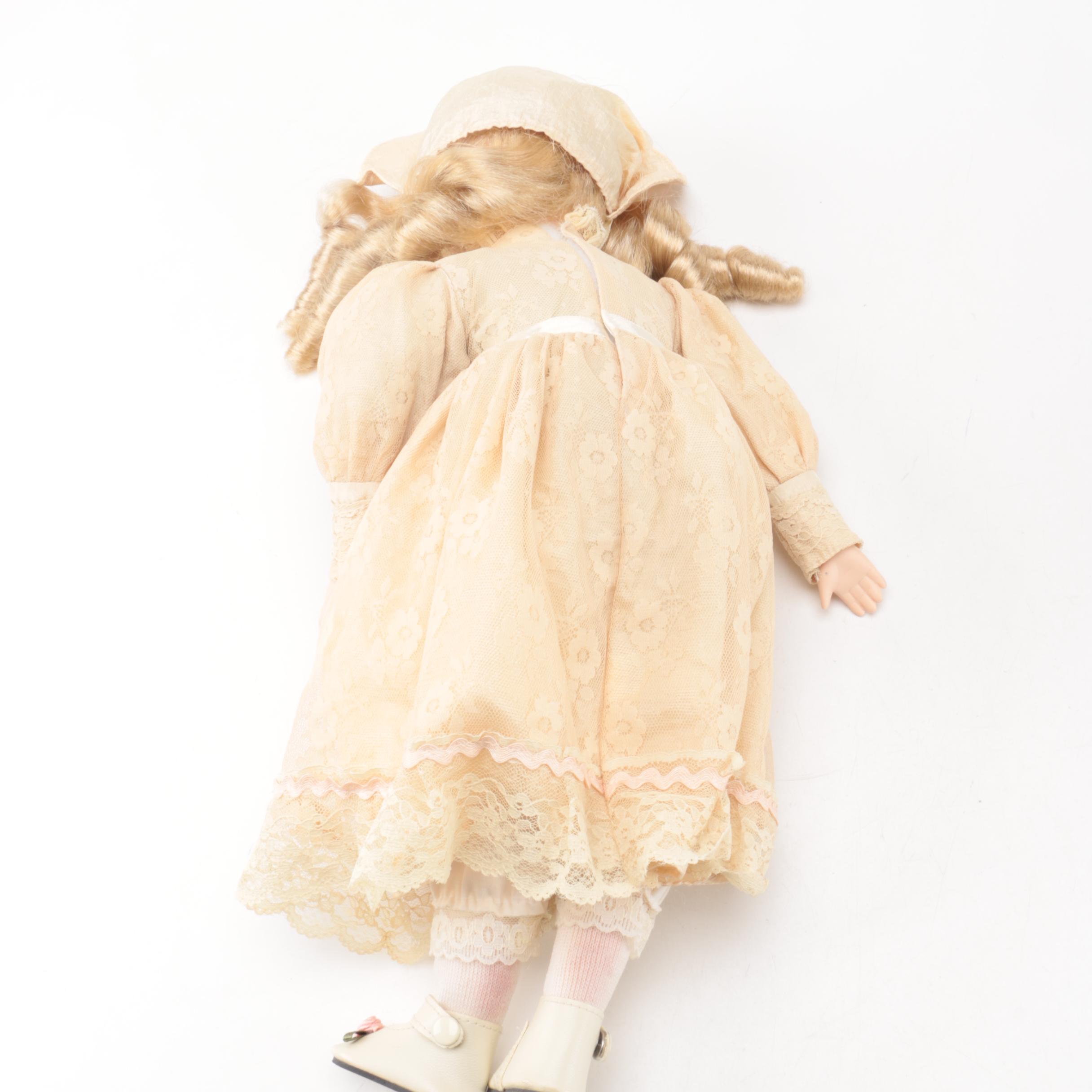 Vintage Porcelain Dolls with Blue Eyes and Blonde Curls