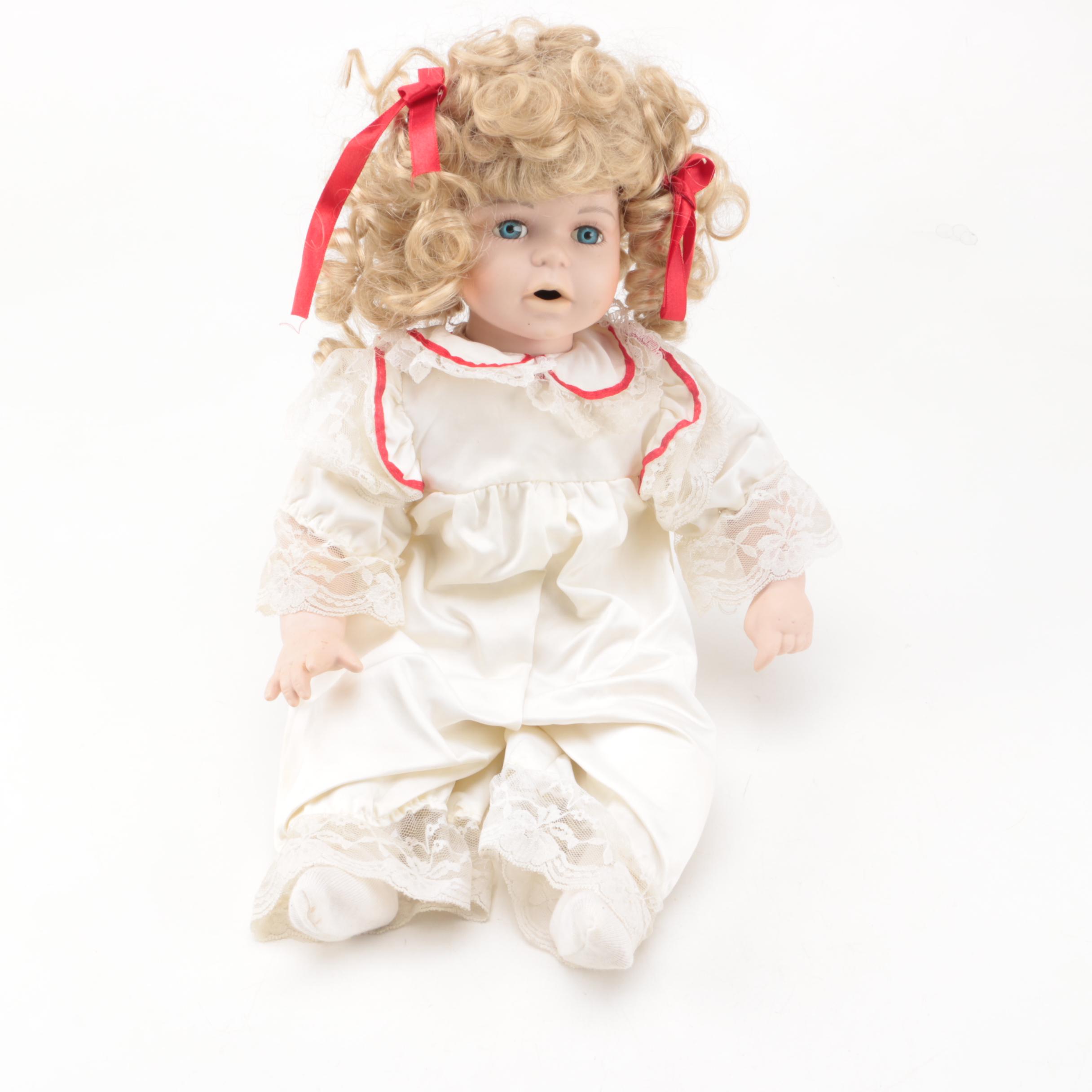 Vintage Porcelain Dolls with Blue Eyes and Blonde Curls