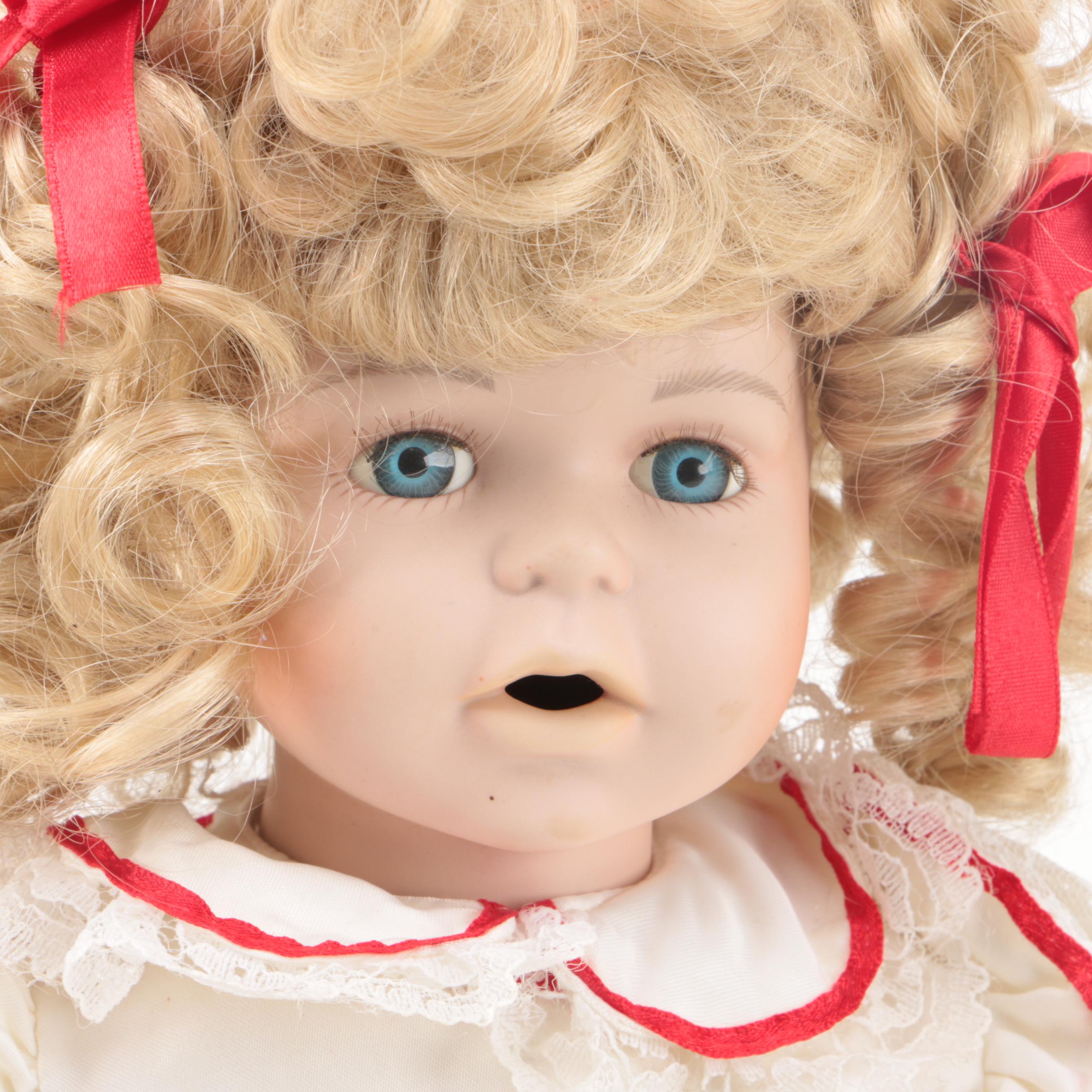 Vintage Porcelain Dolls with Blue Eyes and Blonde Curls
