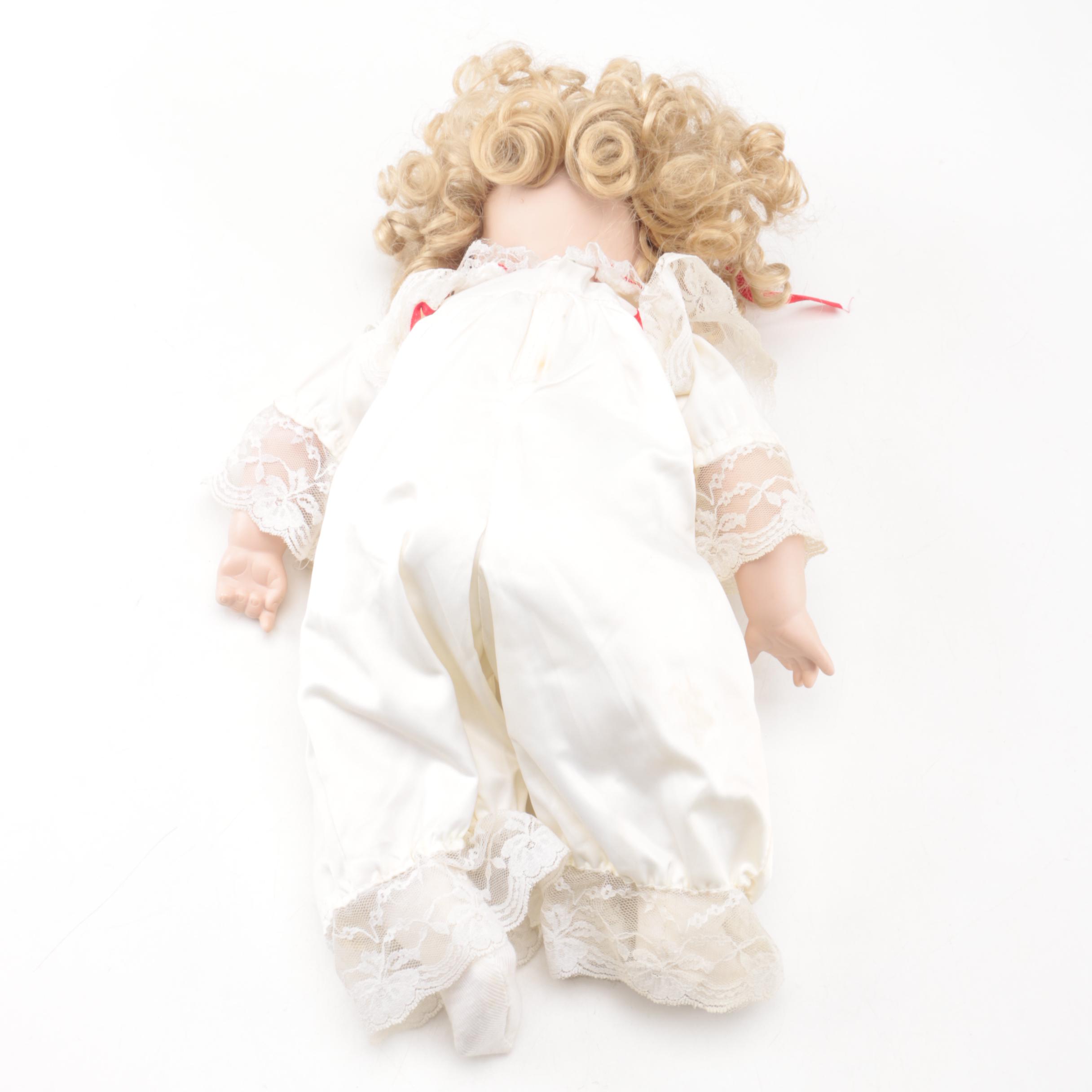 Vintage Porcelain Dolls with Blue Eyes and Blonde Curls