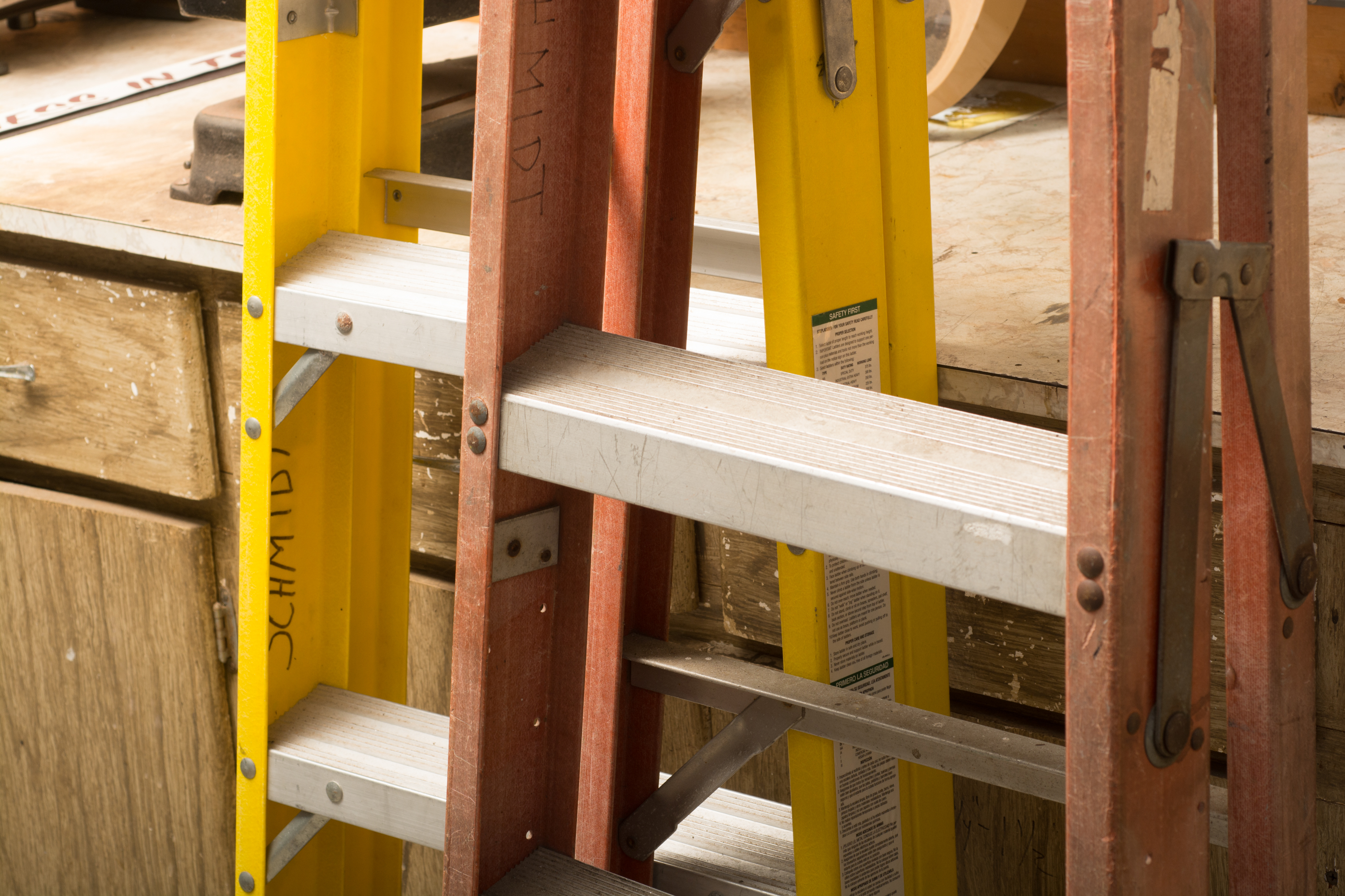 Pair of Folding A-Frame Ladders by Louisville Ladders and Husky