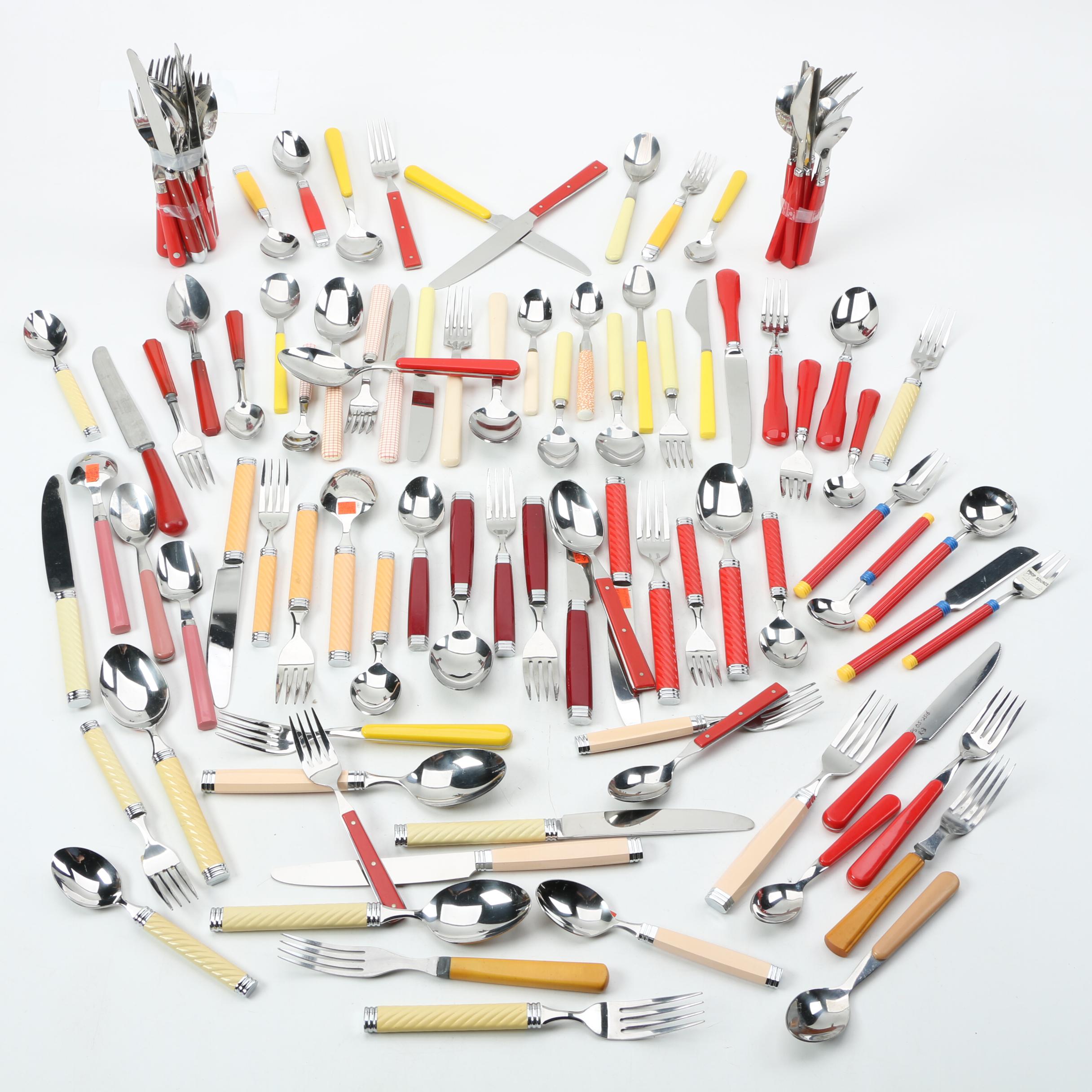 Collection of Stainless Flatware with Plastic Handles.