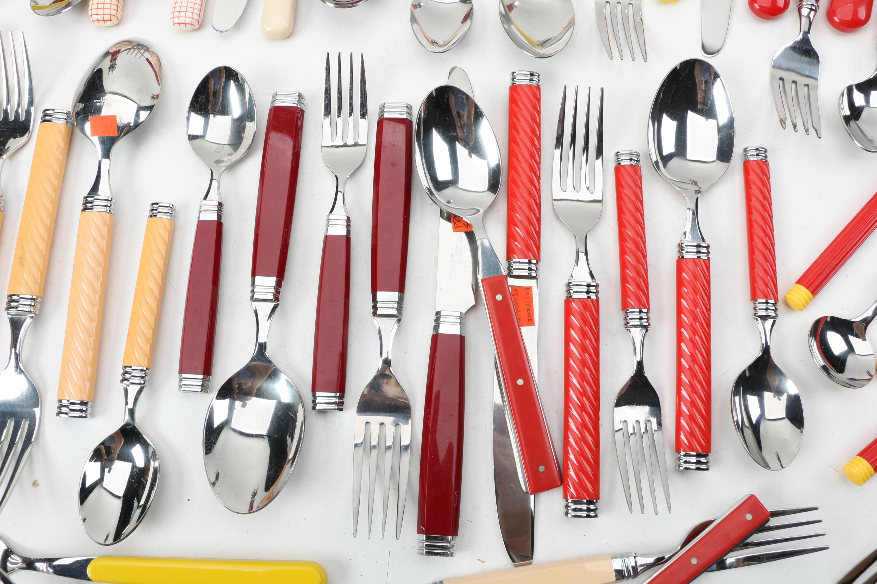 Collection of Stainless Flatware with Plastic Handles.