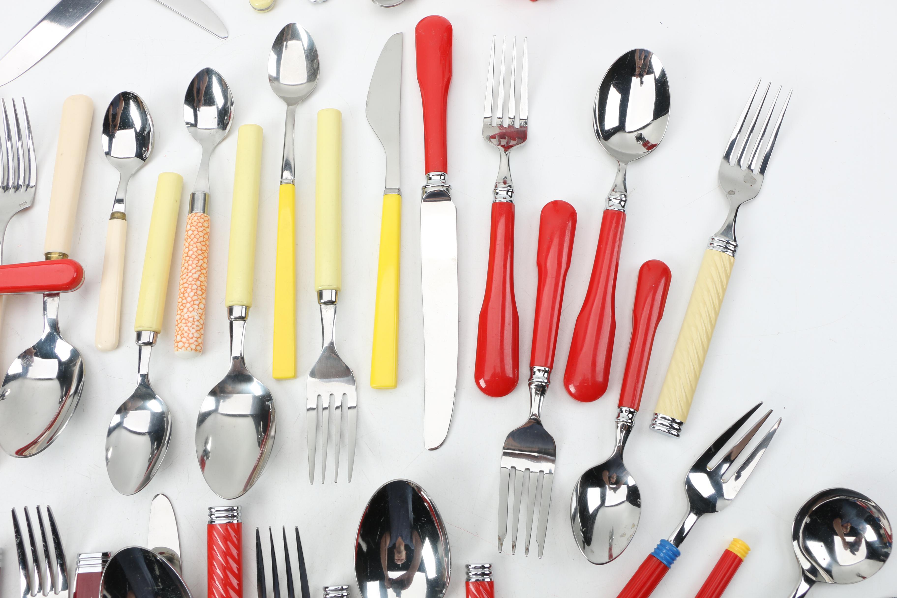 Collection of Stainless Flatware with Plastic Handles.