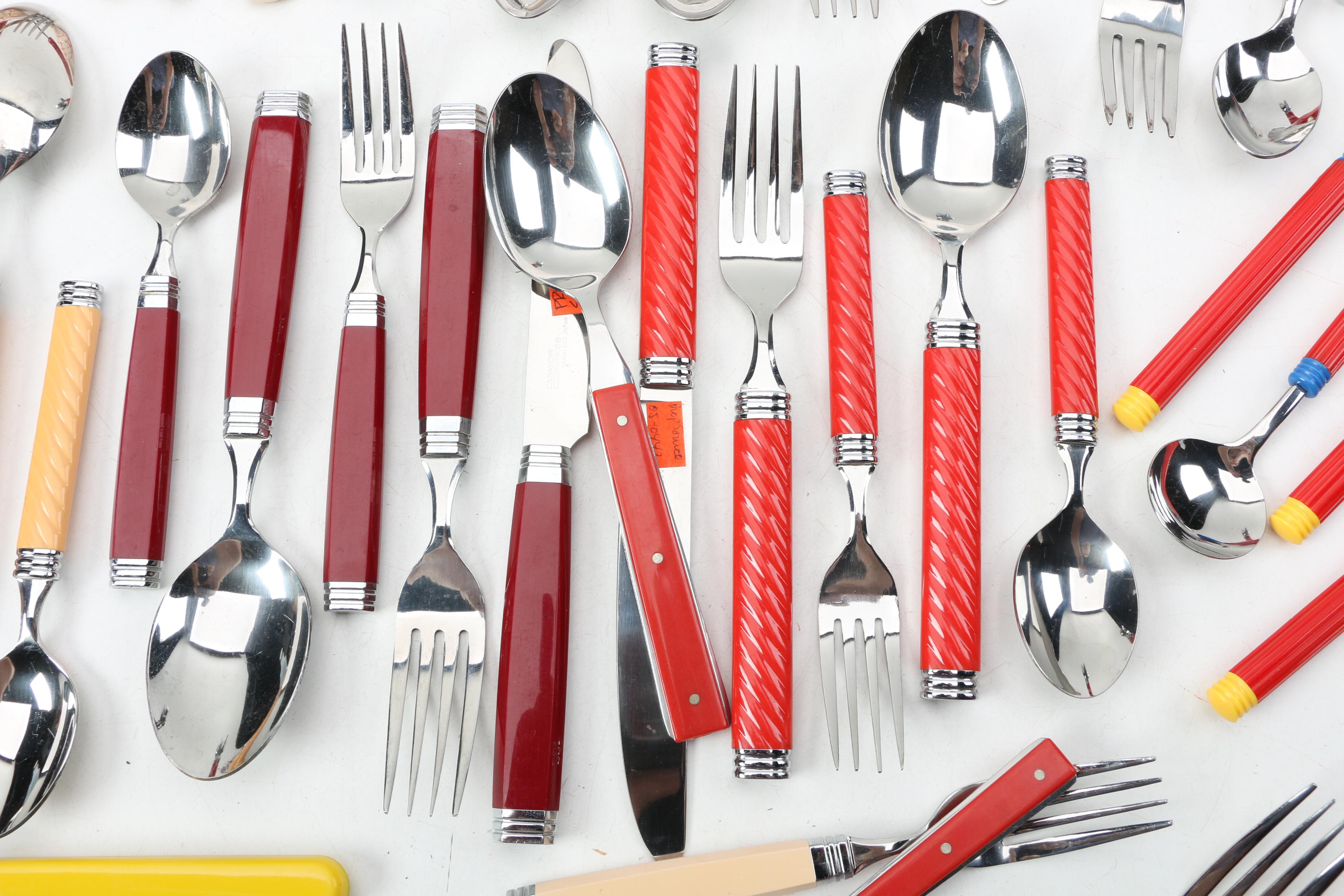 Collection of Stainless Flatware with Plastic Handles.