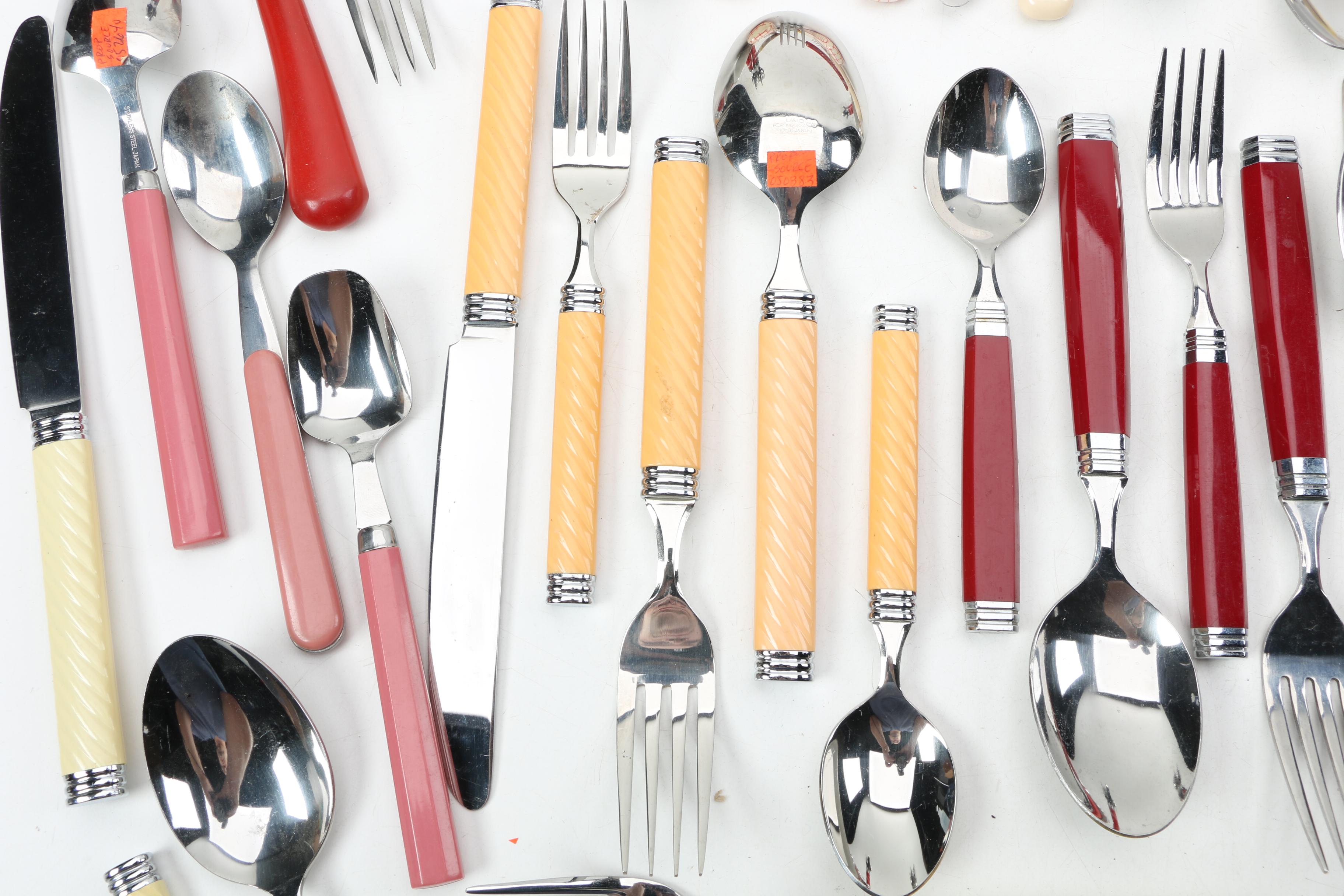 Collection of Stainless Flatware with Plastic Handles.