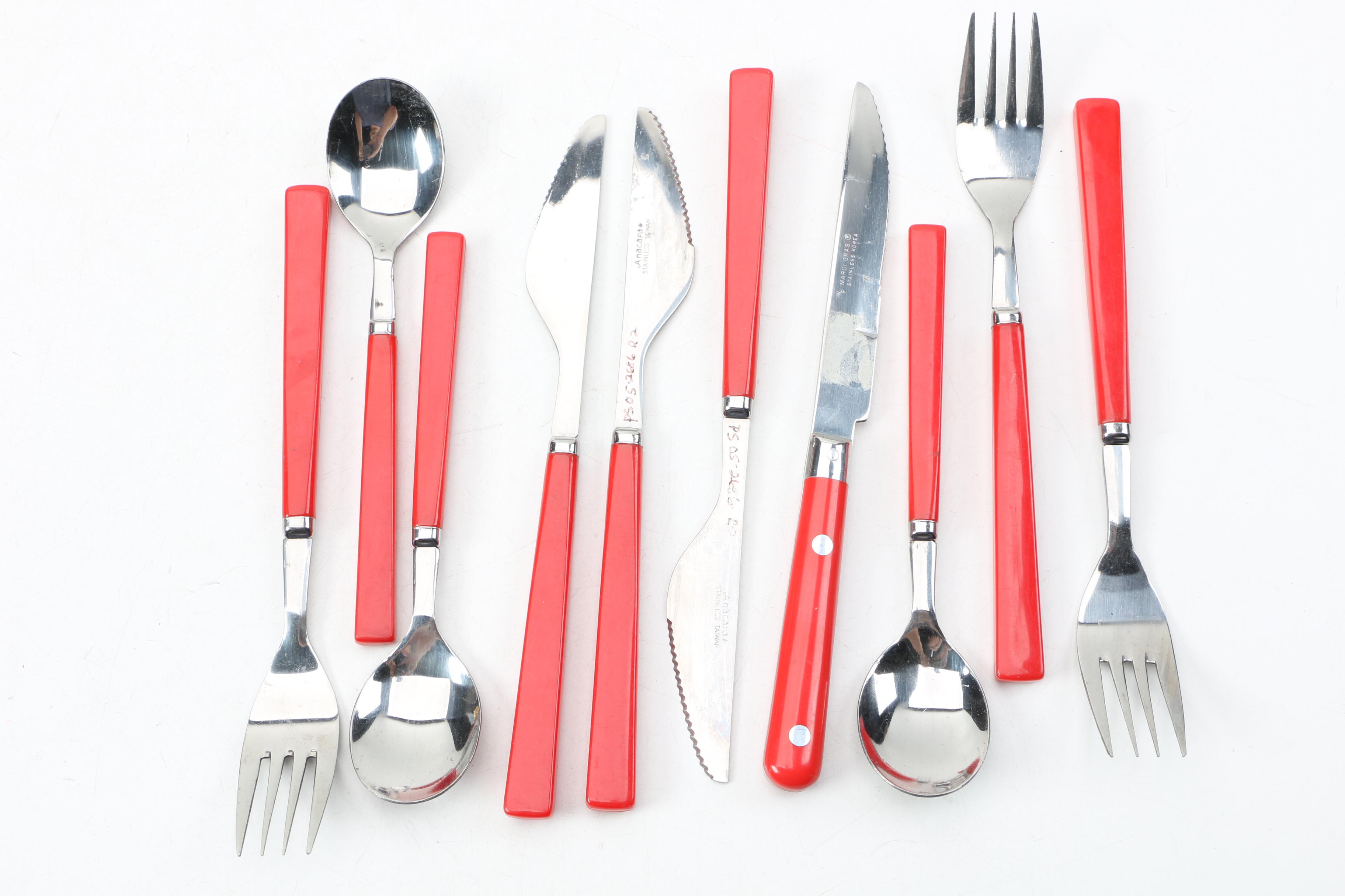 Collection of Stainless Flatware with Plastic Handles.