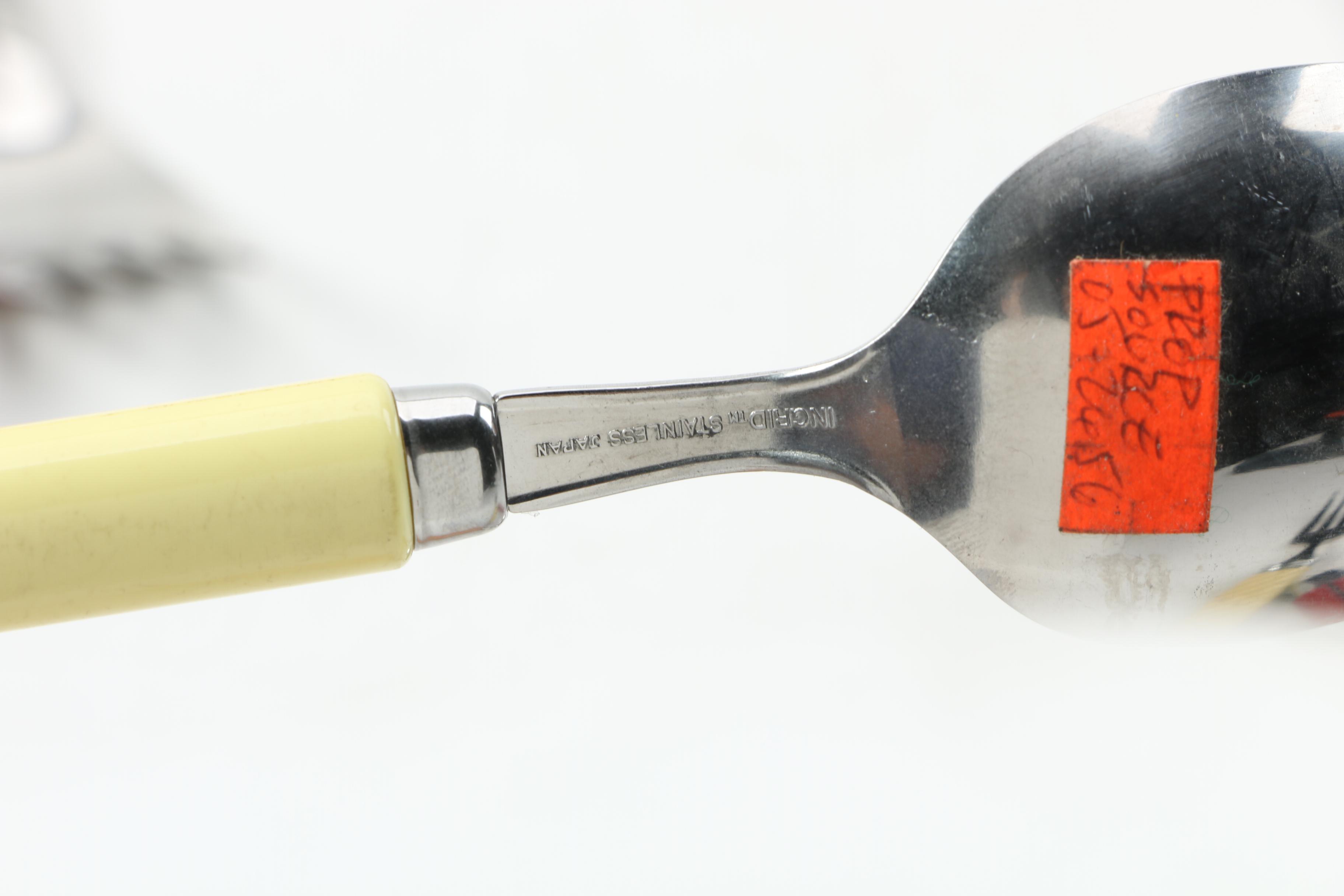 Collection of Stainless Flatware with Plastic Handles.