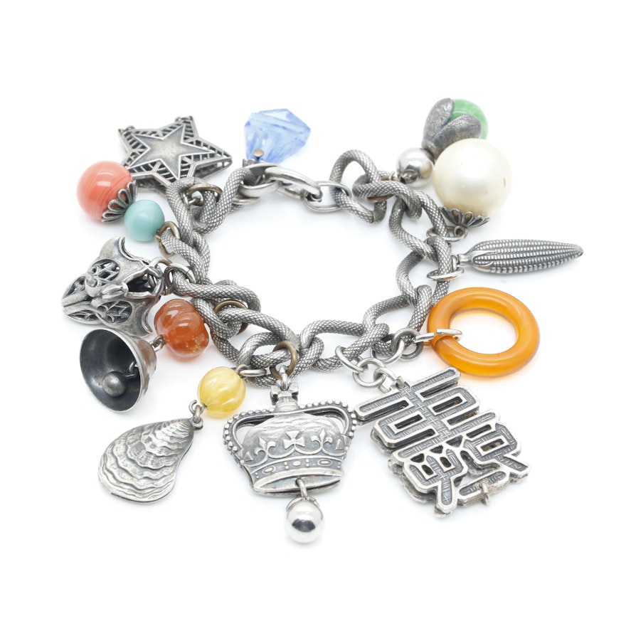 Silver Tone Charm Bracelet Including Glass, 900, 925, and 800 Silver