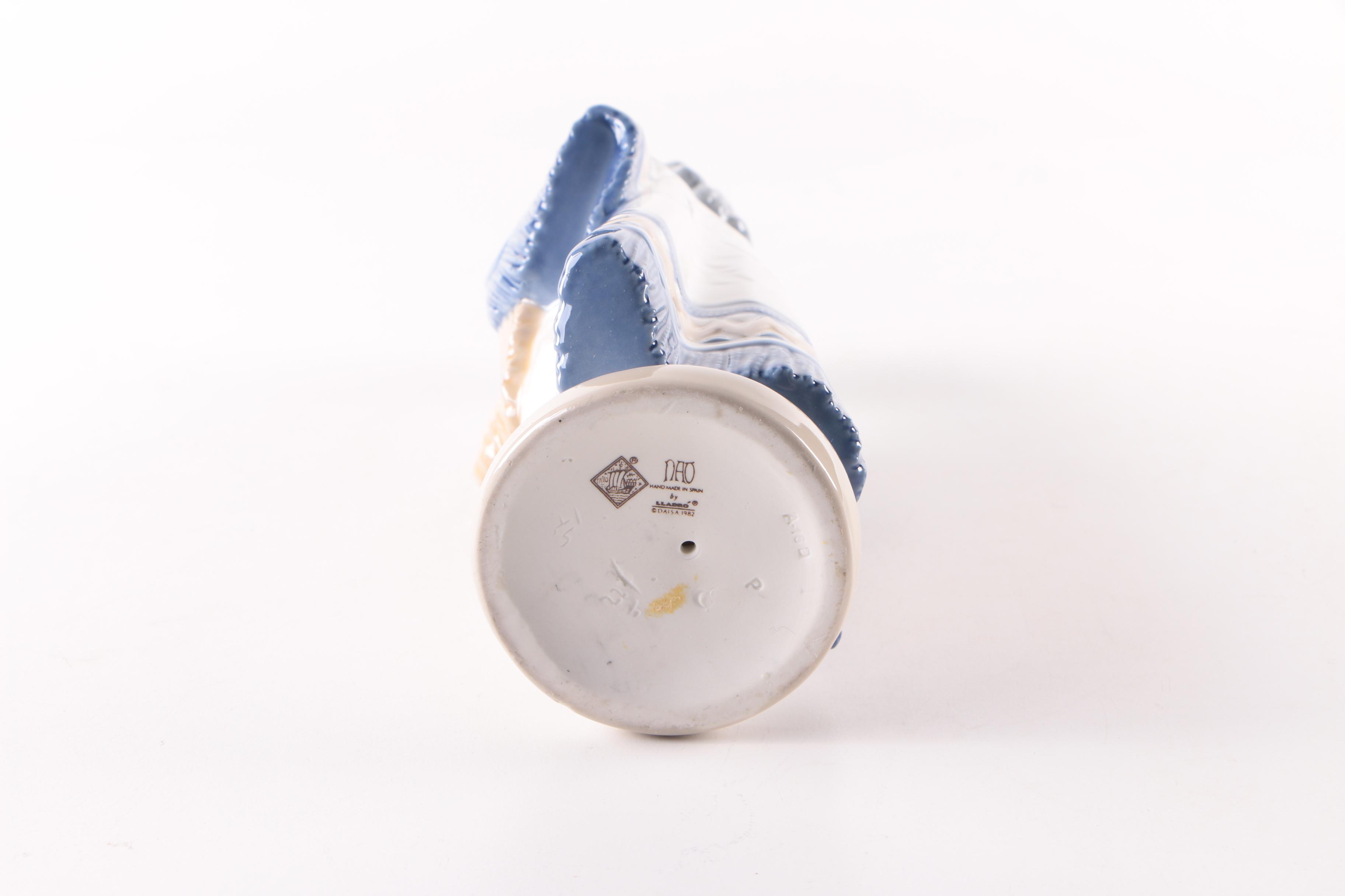 NAO by Lladró Girl Holding Hat Figurine