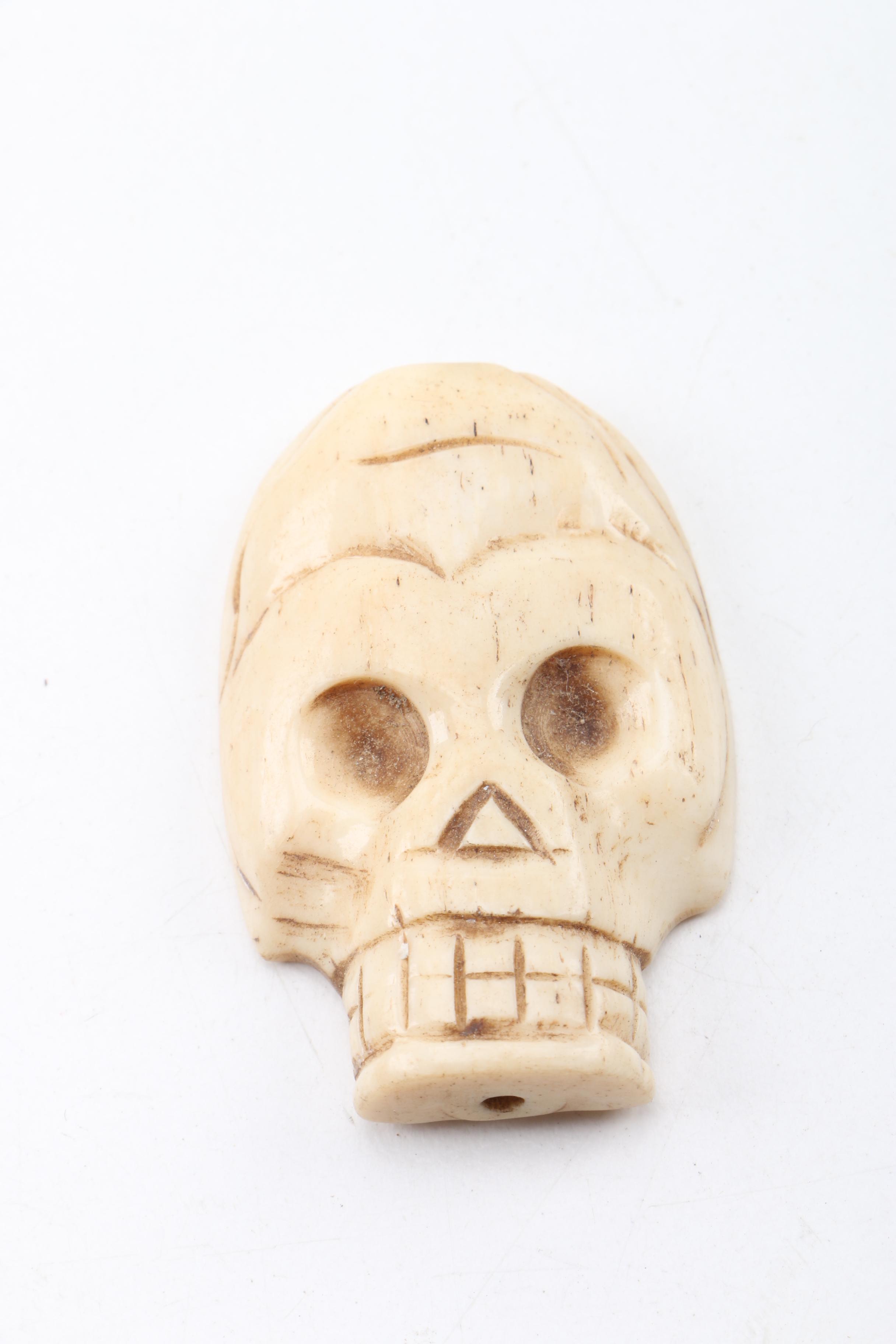 Carved Bone Skull Figurines