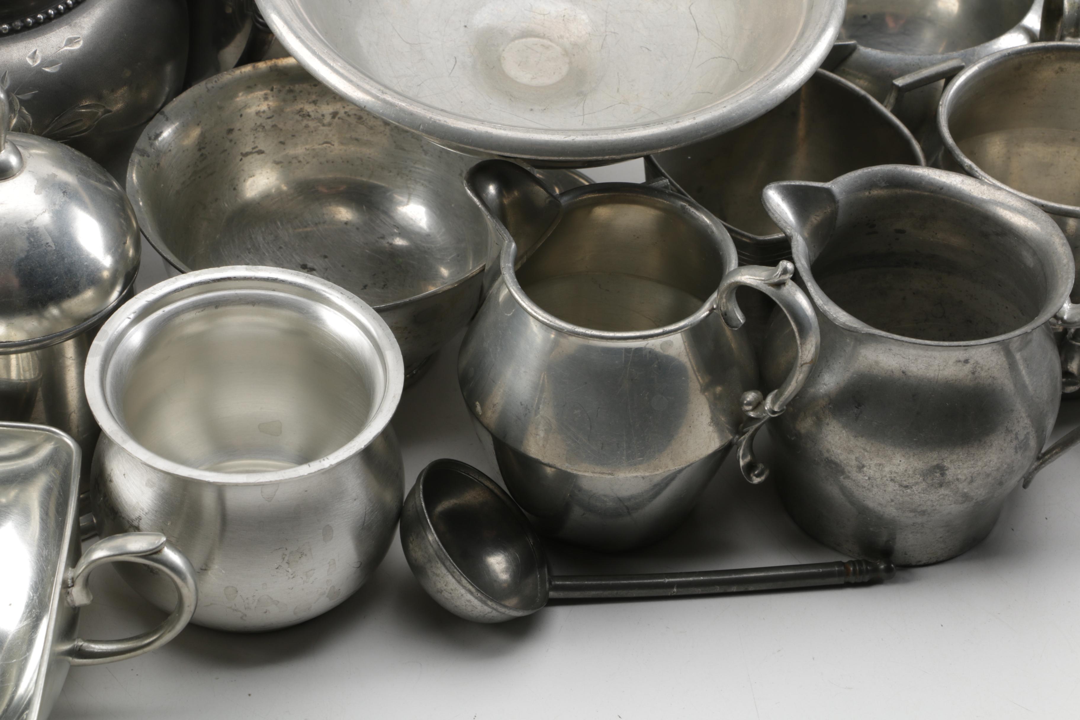 Large Assortment of Pewter Serveware Featuring Crescent Pewter