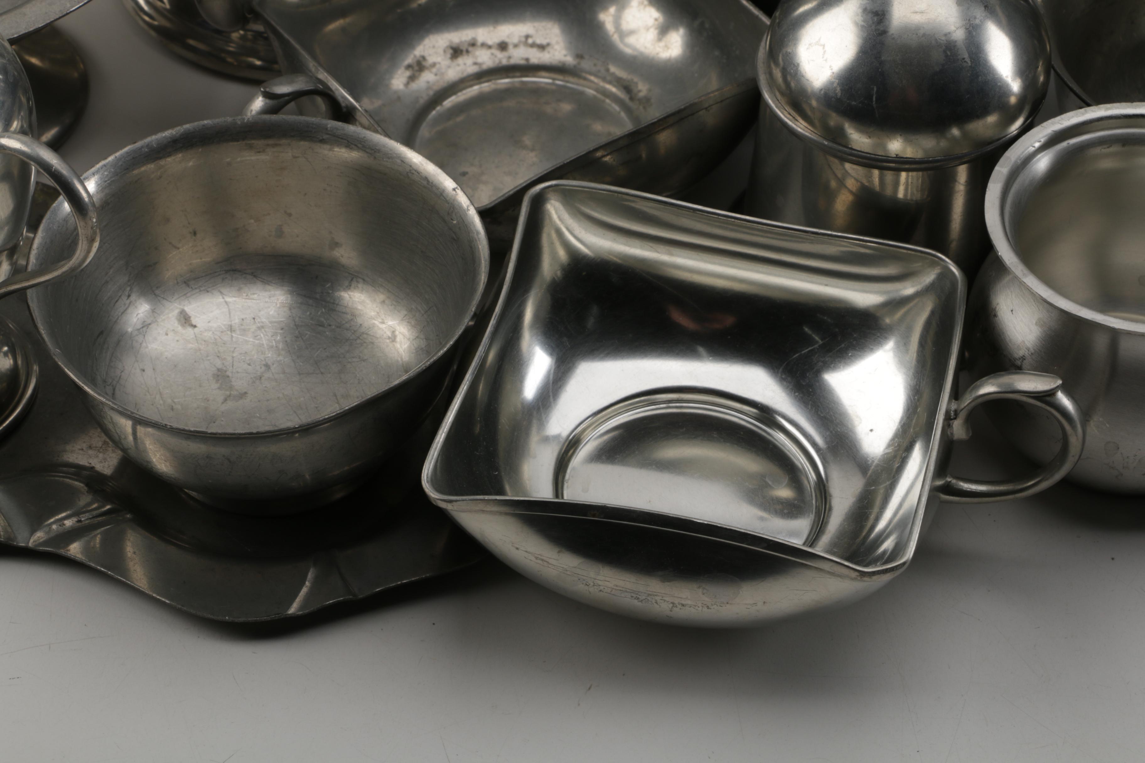Large Assortment of Pewter Serveware Featuring Crescent Pewter