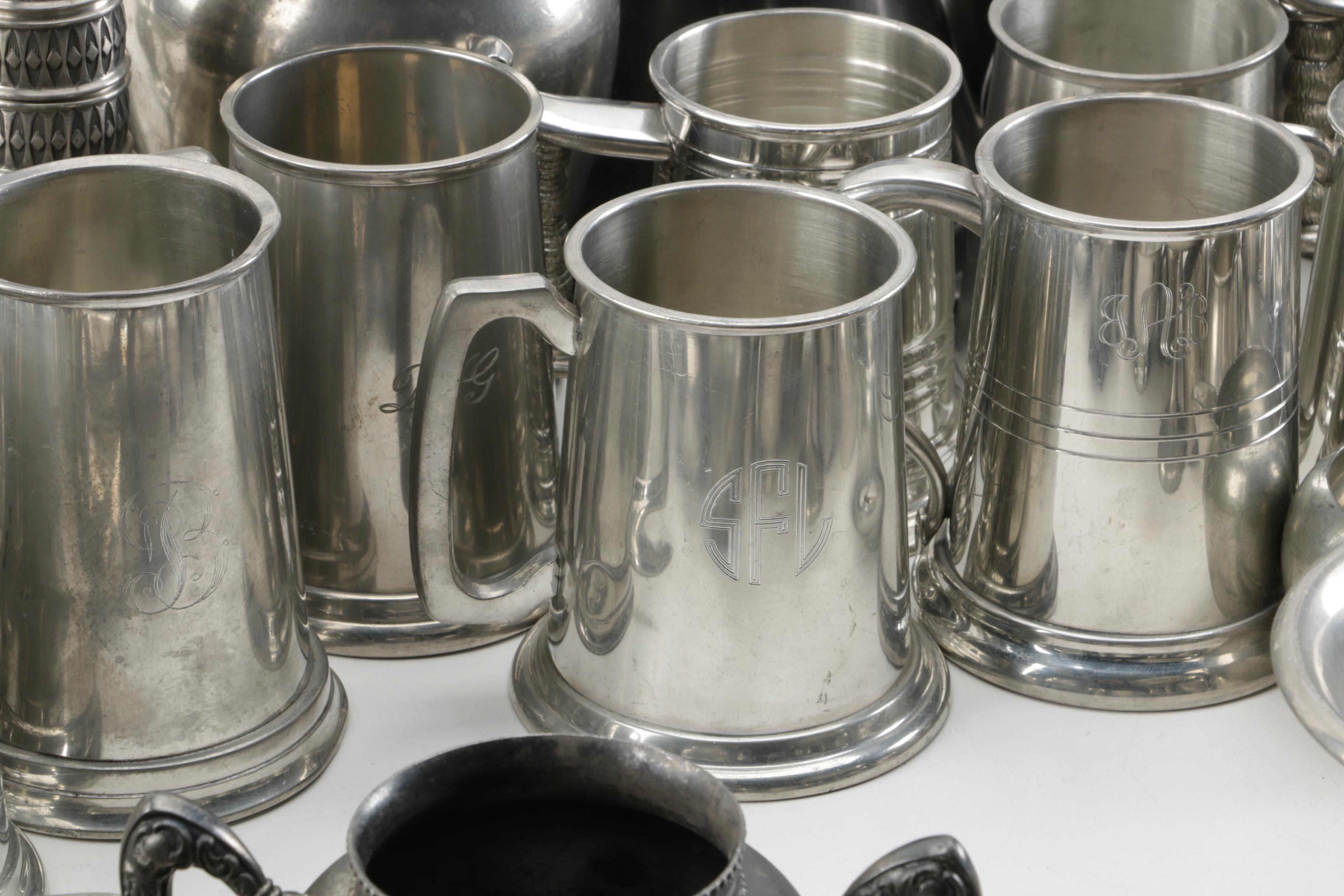 Large Assortment of Pewter Serveware Featuring Crescent Pewter