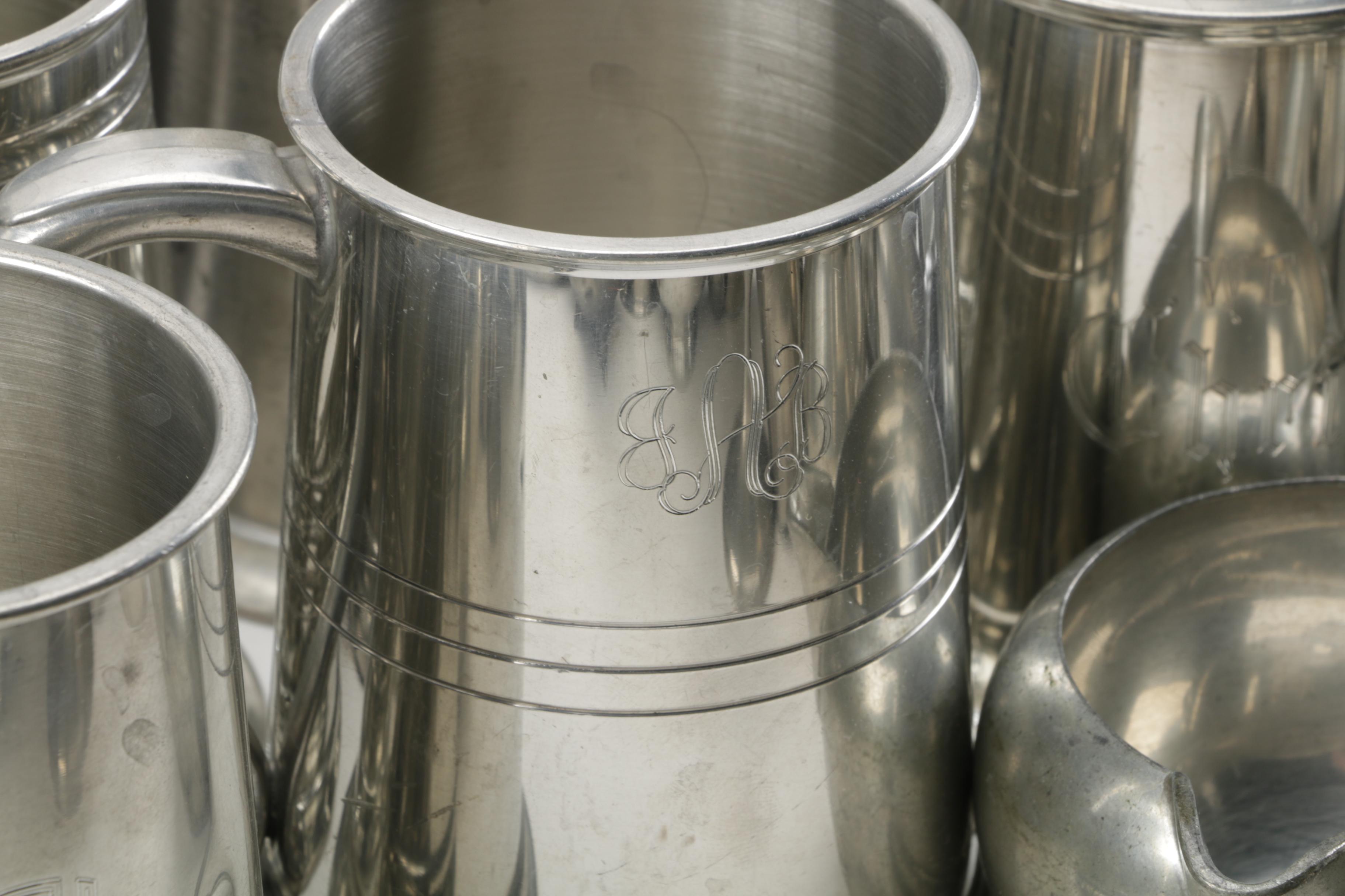 Large Assortment of Pewter Serveware Featuring Crescent Pewter