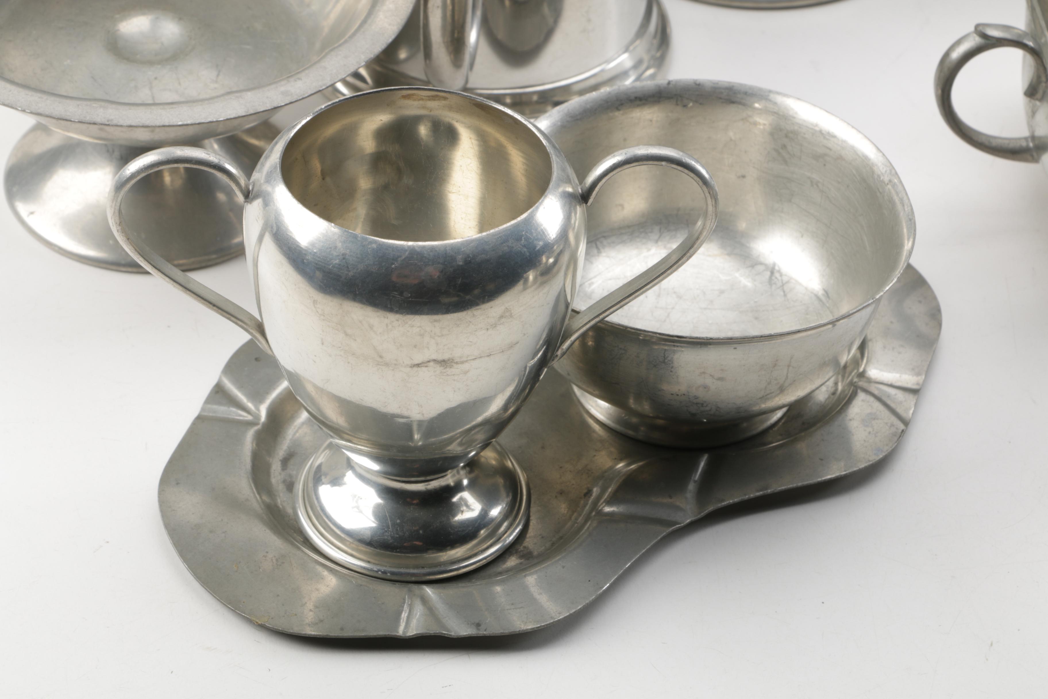 Large Assortment of Pewter Serveware Featuring Crescent Pewter