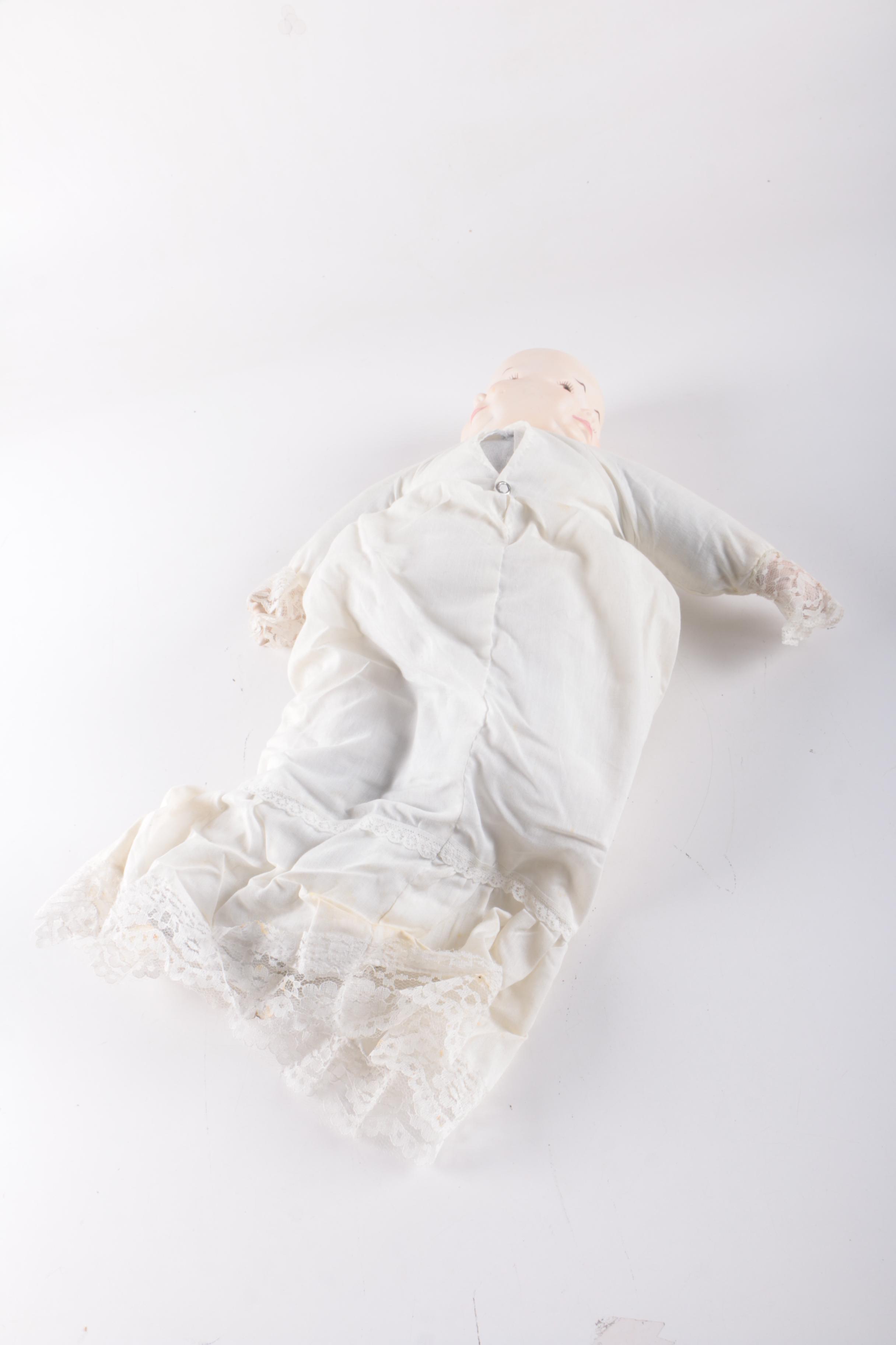 Vintage Three Face Bisque Head Kit Doll with Baby Doll in Bassinet