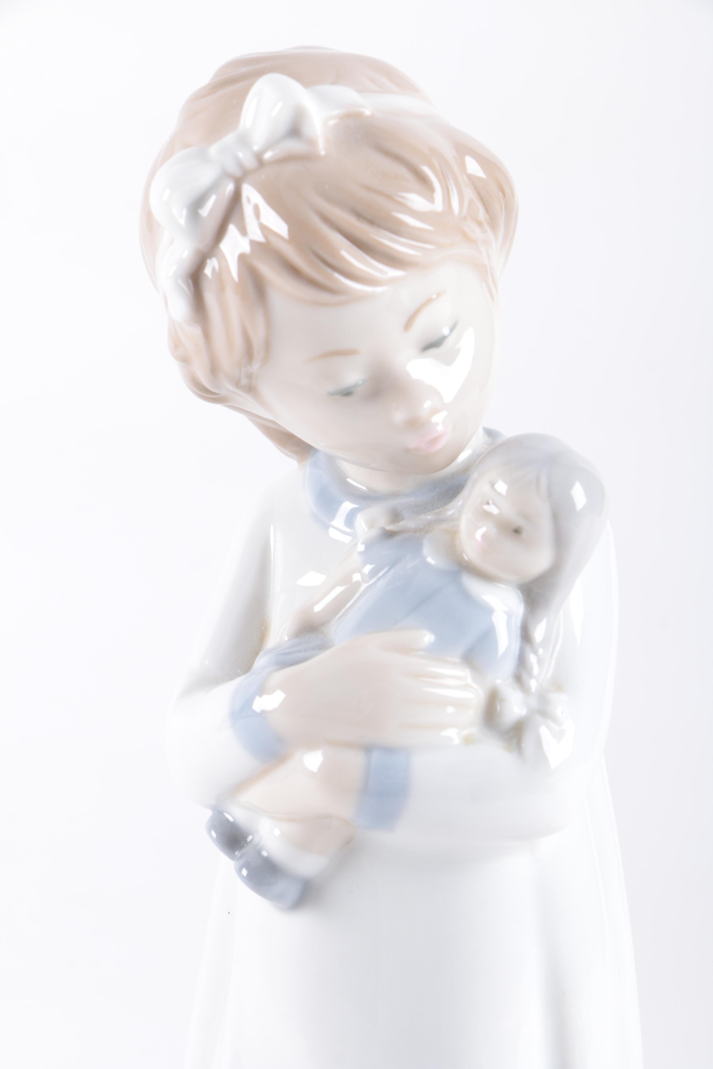 NAO by Lladró "Girl with Doll" Figurine