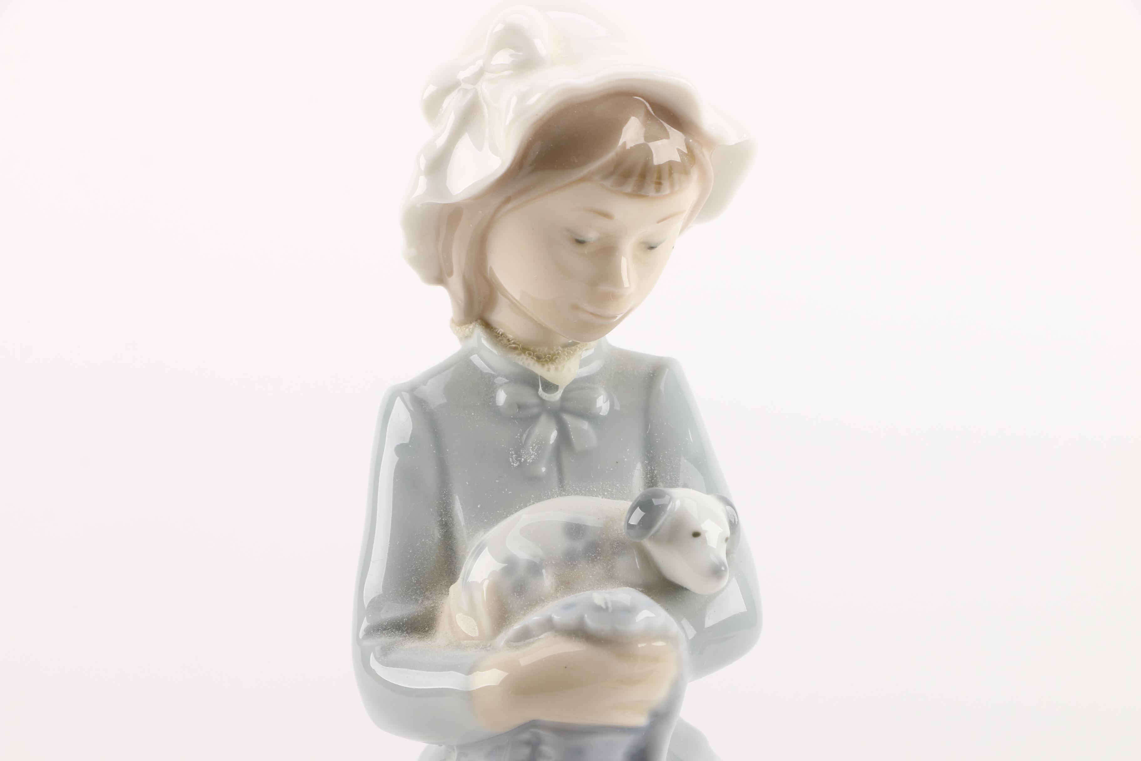 NAO by Lladró "Girl with Puppy Dog and Blanket" Figurine