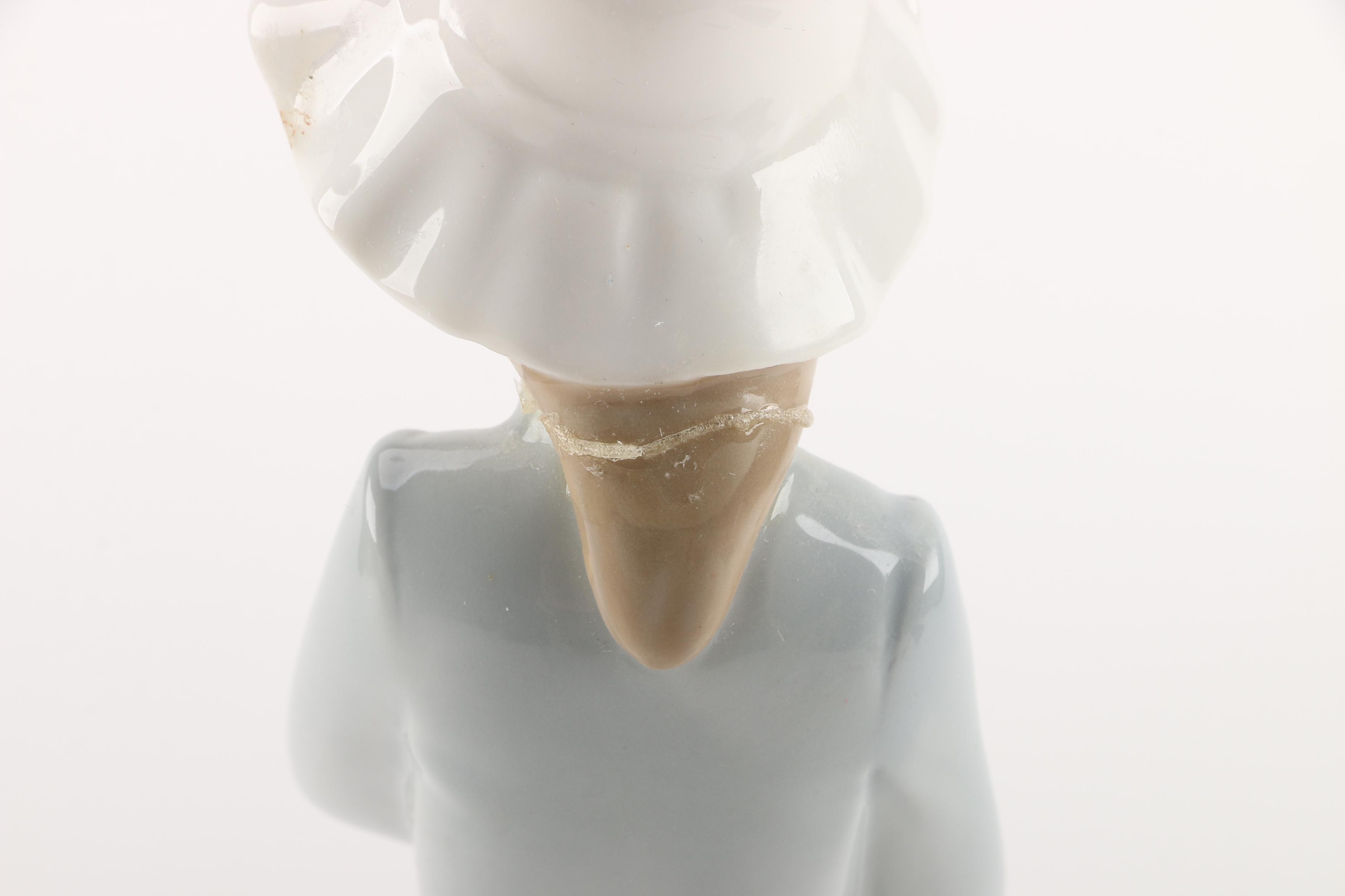 NAO by Lladró "Girl with Puppy Dog and Blanket" Figurine