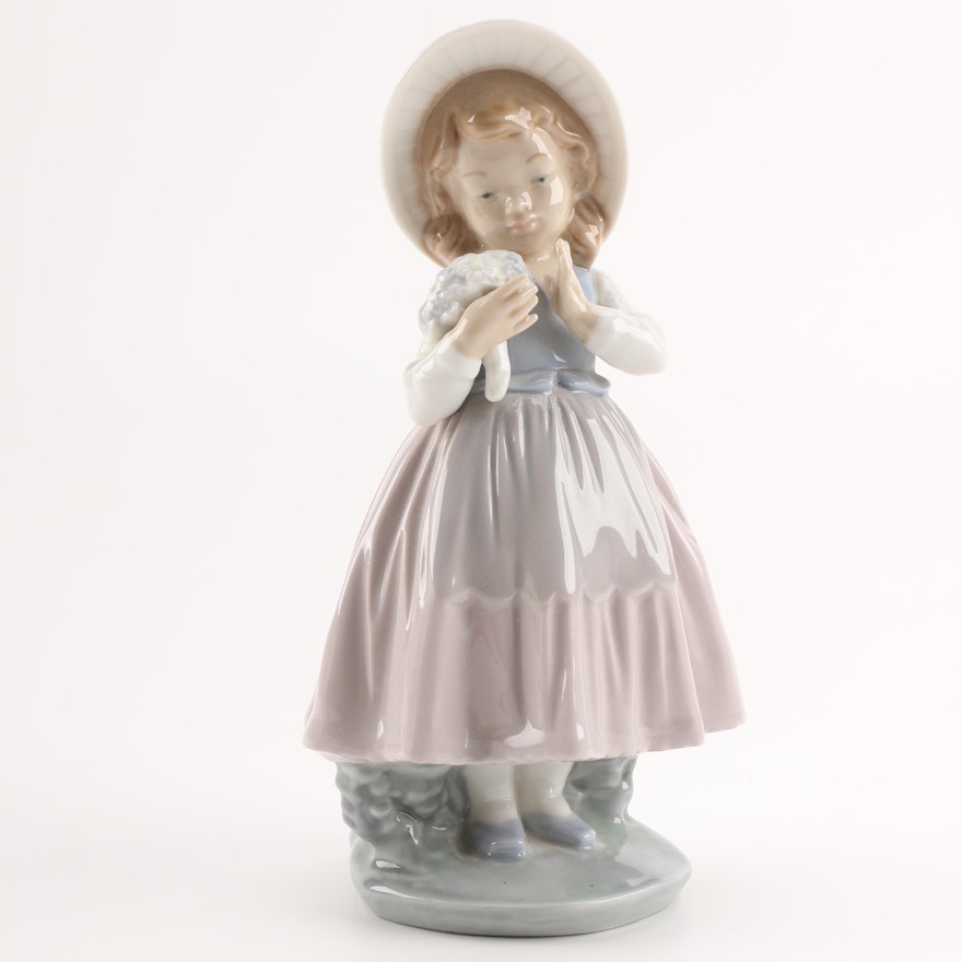 NAO by Lladró "Girl Admiring Bouquet" Figurine